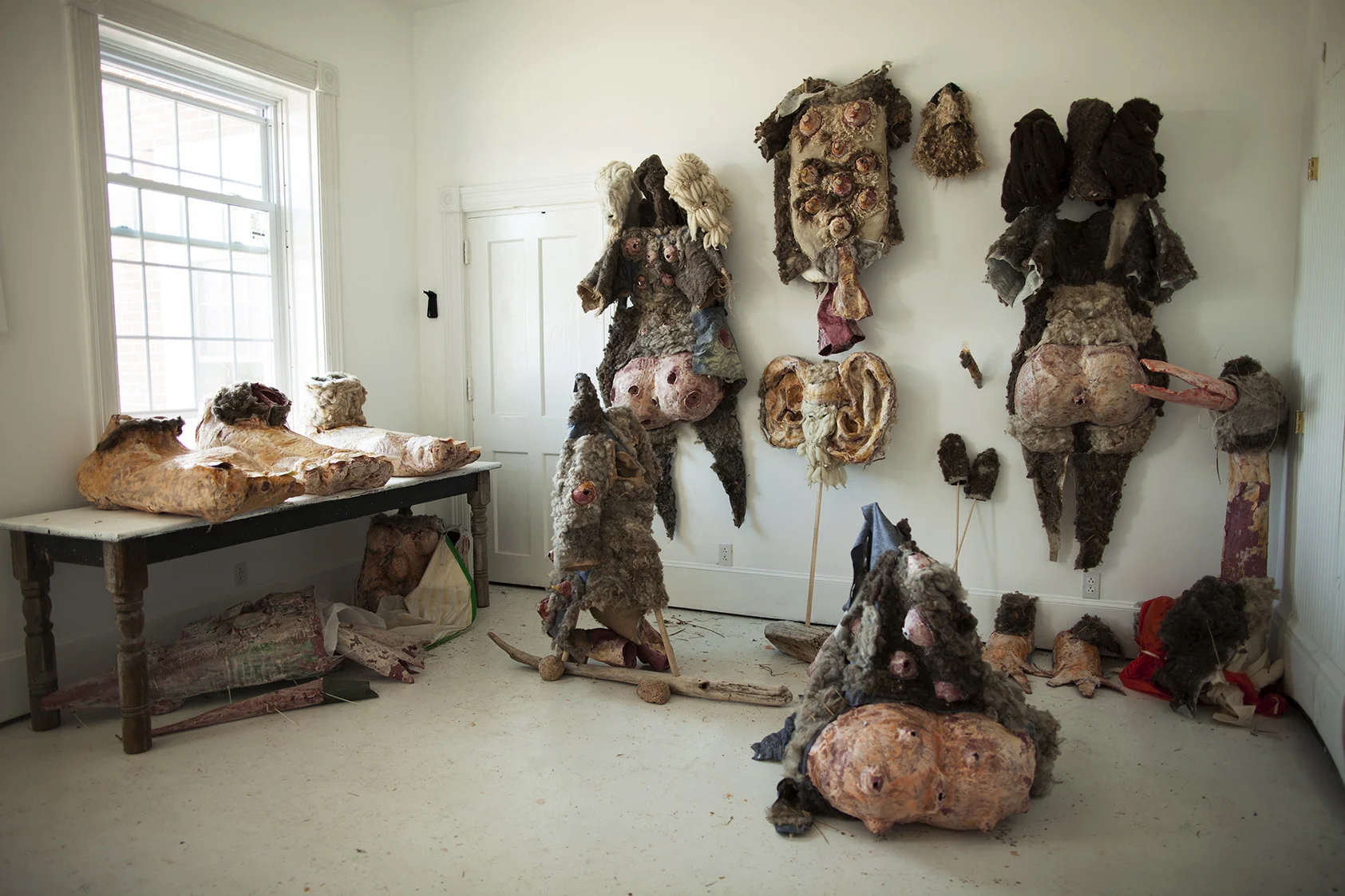 Taxidermy for humans of a dystopian future , 2016, papier-mâche, raw wool, felt, wax, latex, shellac, burlap, wood. Installed at The Lighthouse Works, Fishers Island, NY