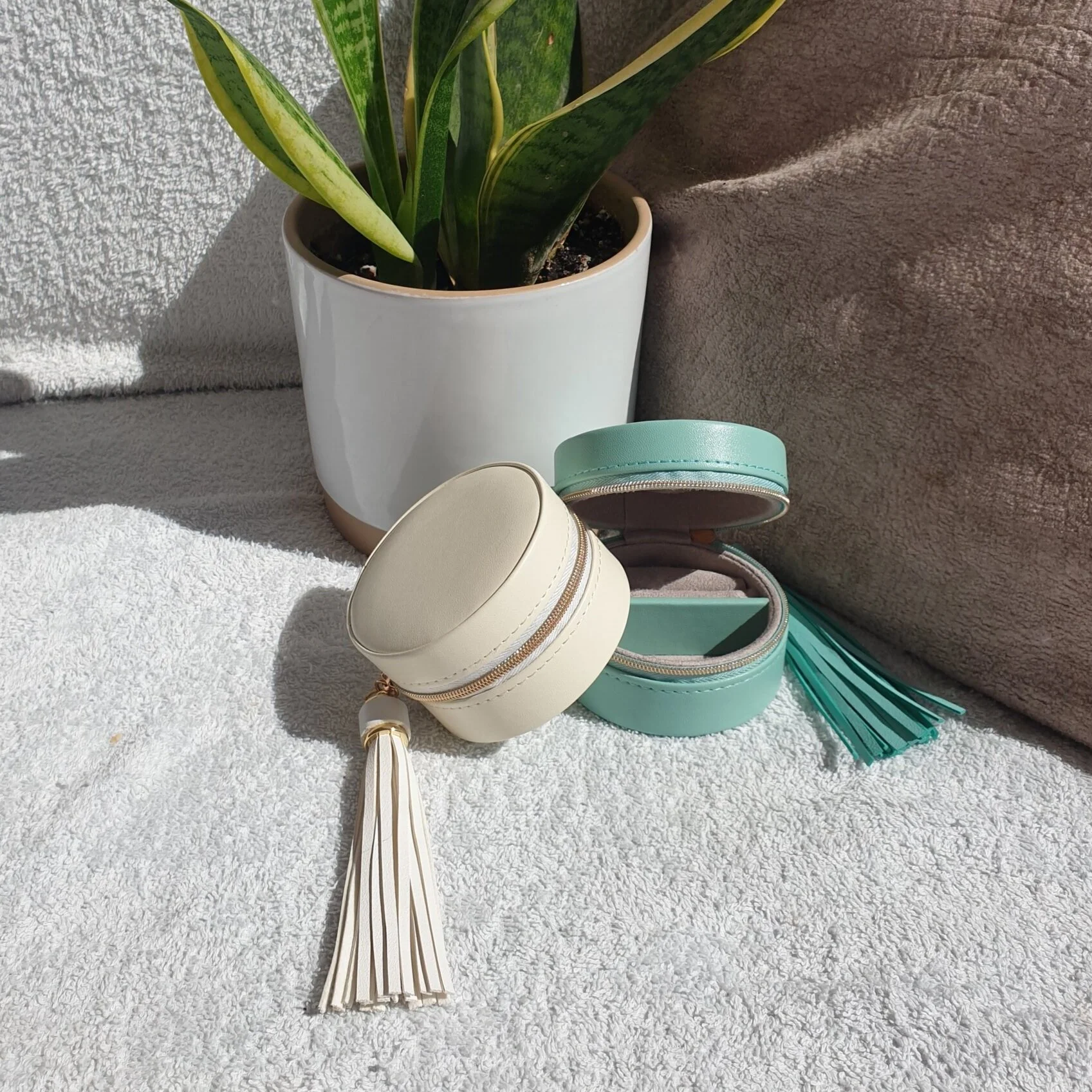 Bliss+tasseled+travel+cases+in+turquoise+and+cream.jpg