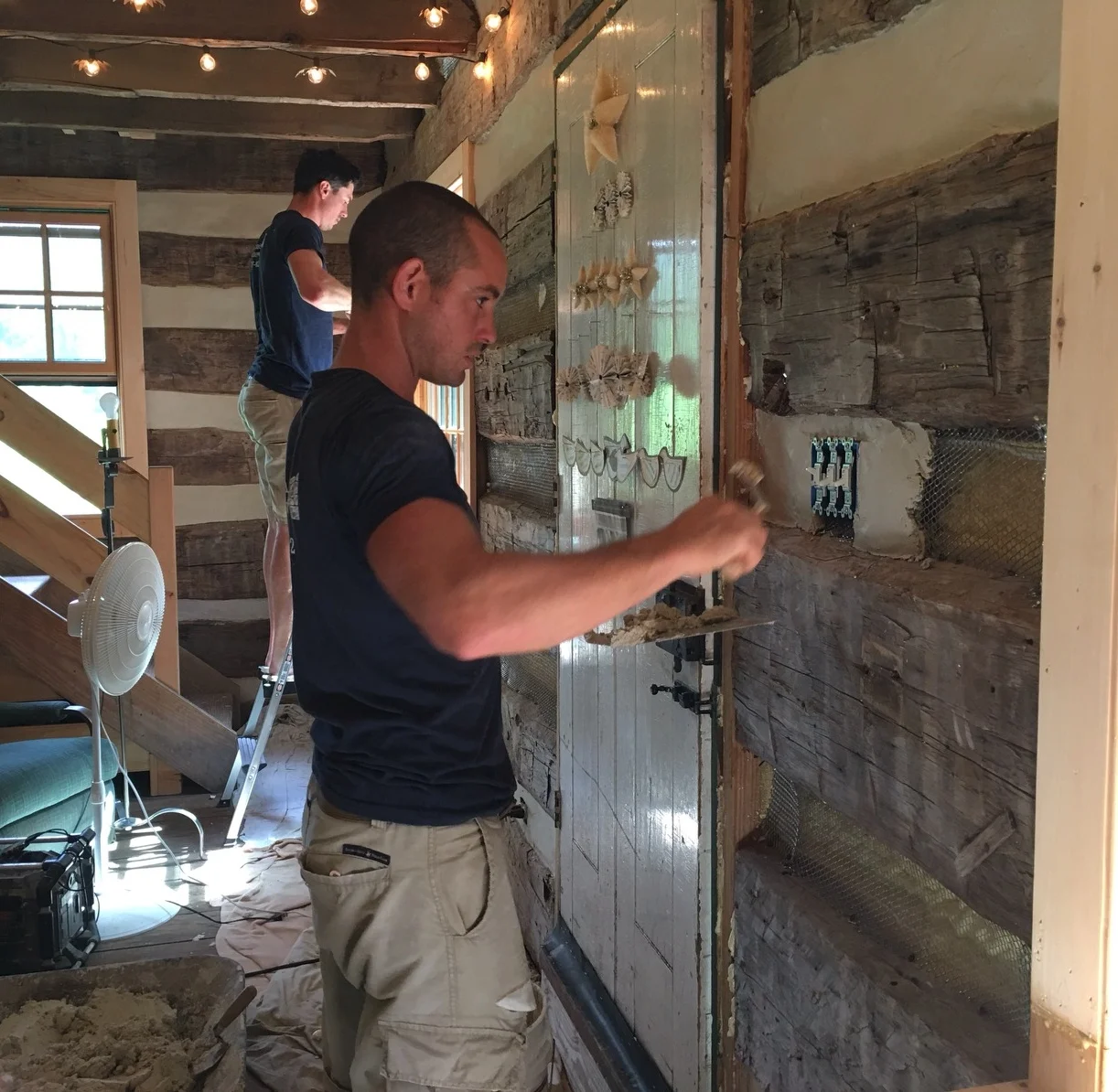  Applying the interior chinking in this log cabin in northern PA 