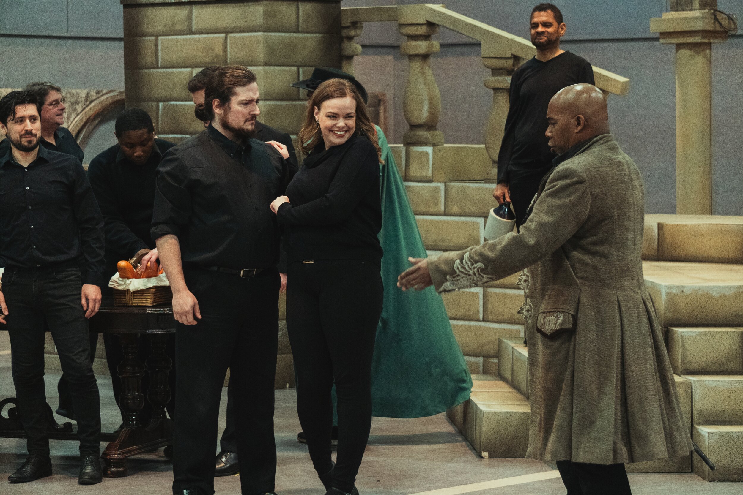  Eric McKeever as Don Giovanni (right); Janese Pentico as Zerlina (center); Alexander Henderson as Masetto (left); Indianapolis Opera Chorus  Photo courtesy of Benjamin Werley 