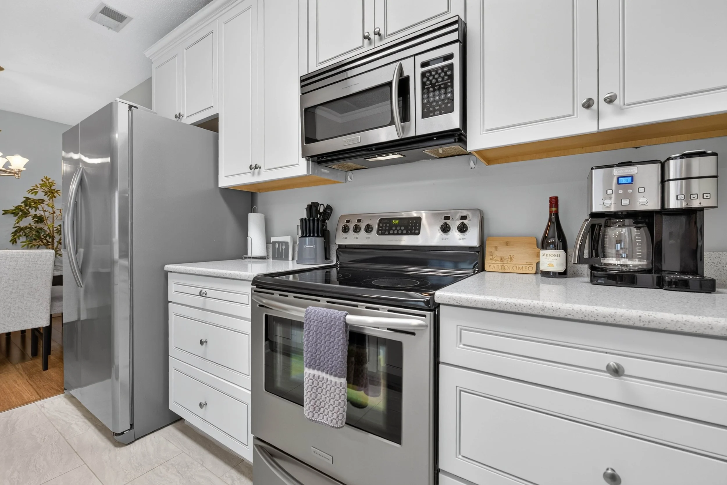 Stainless appliances and abundant cabinetry give the updated kitchen a polished look with practical storage.