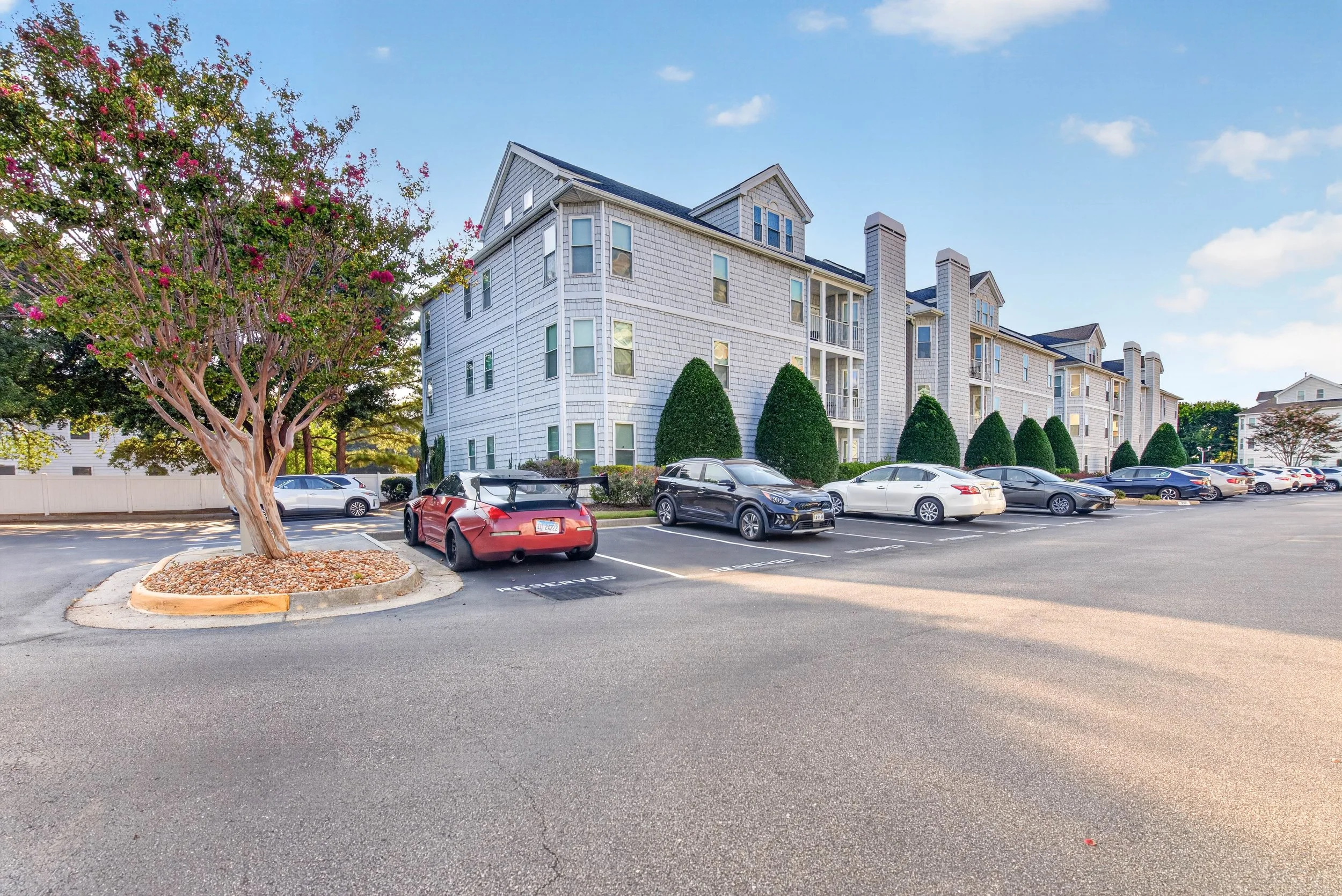 Landscaped grounds and maintained surroundings contribute to the polished setting and low-maintenance appeal.