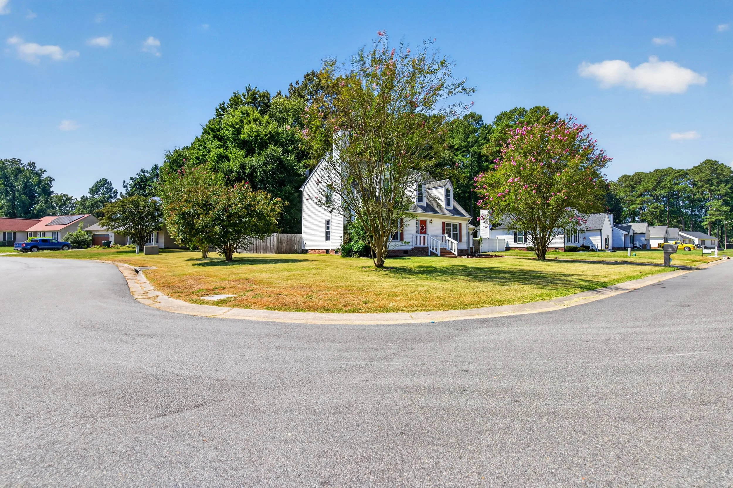 The corner setting gives the home open views along two sides and more room around the front lawn.