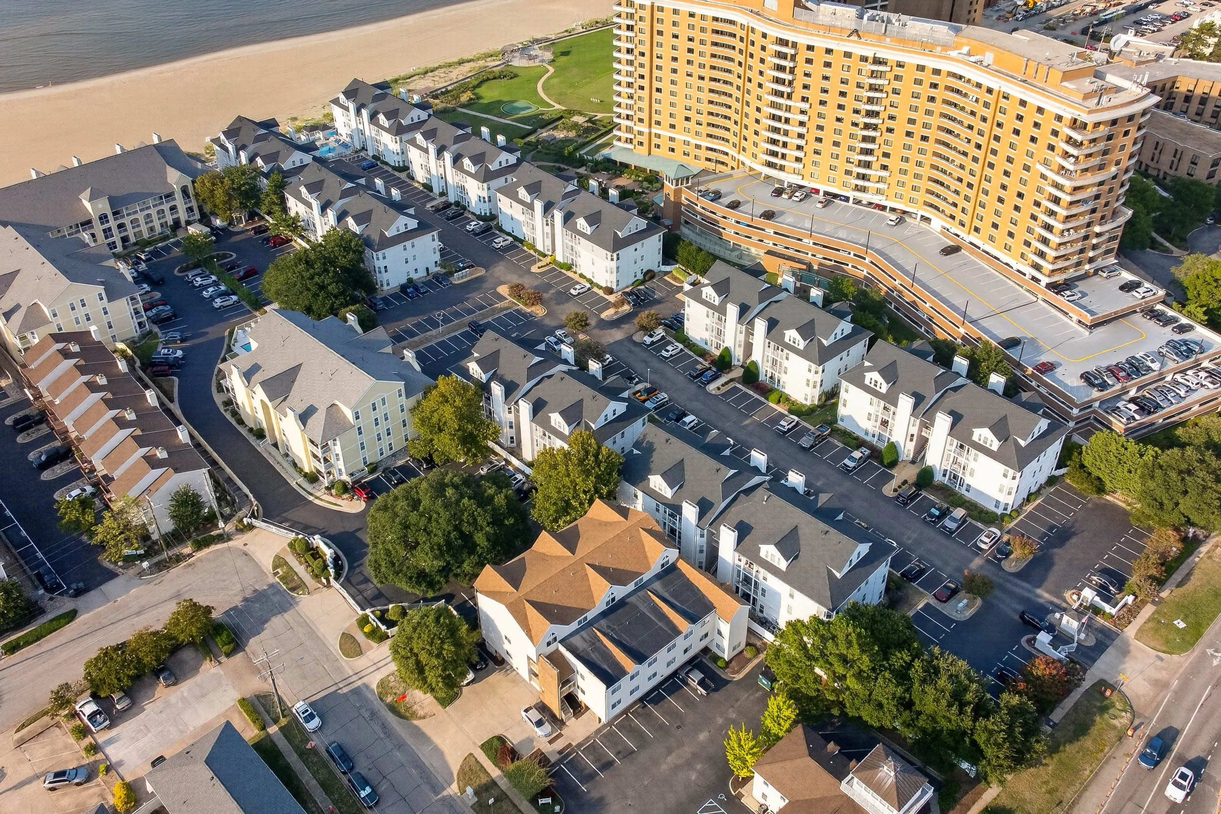 An overhead view shows how the buildings and internal lanes of this gated community come together near the water.