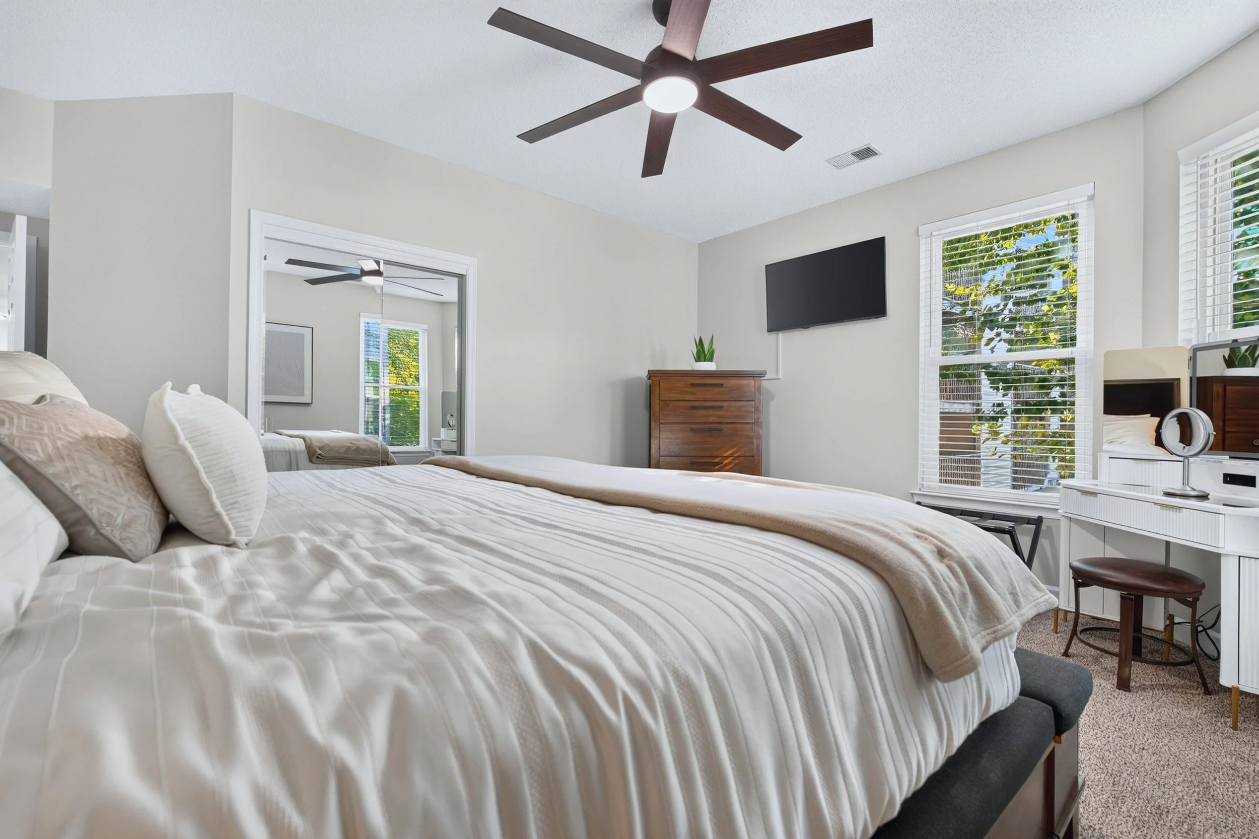 Generous proportions leave room for a reading chair, dressing area or quiet corner within the primary bedroom.