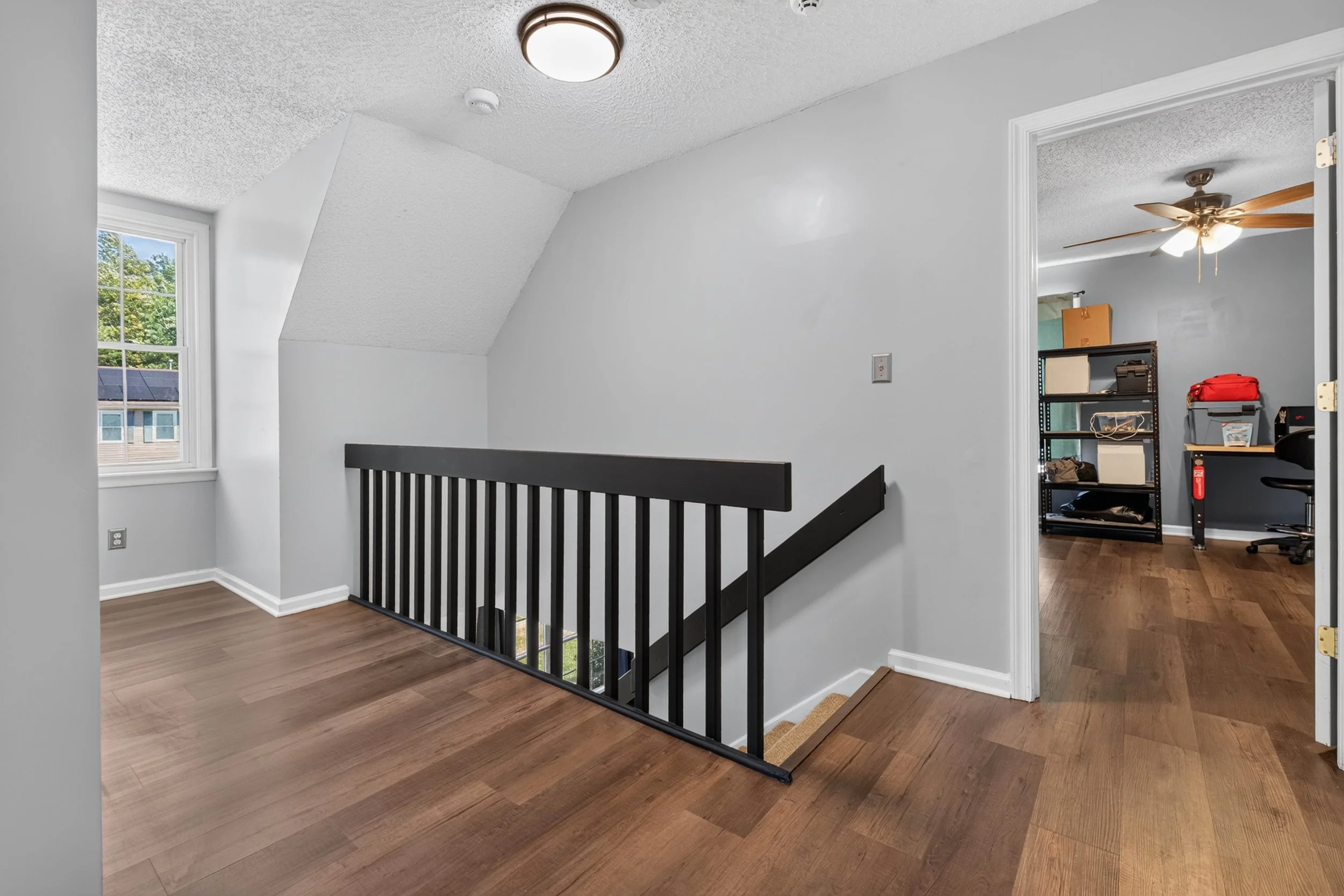 The upstairs landing connects three bedrooms and the second full bathroom.