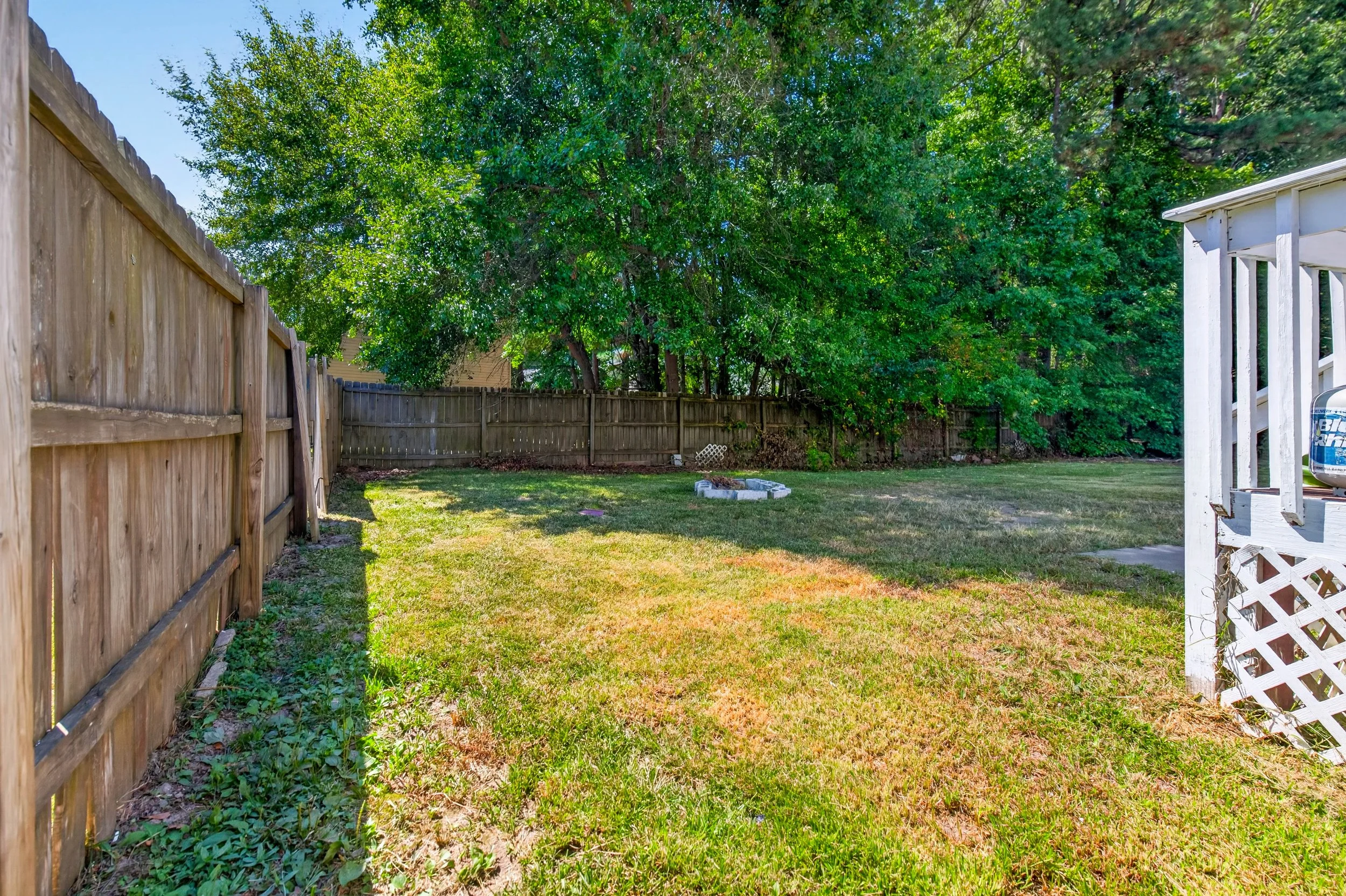 The fenced side yard adds another usable section of outdoor space.