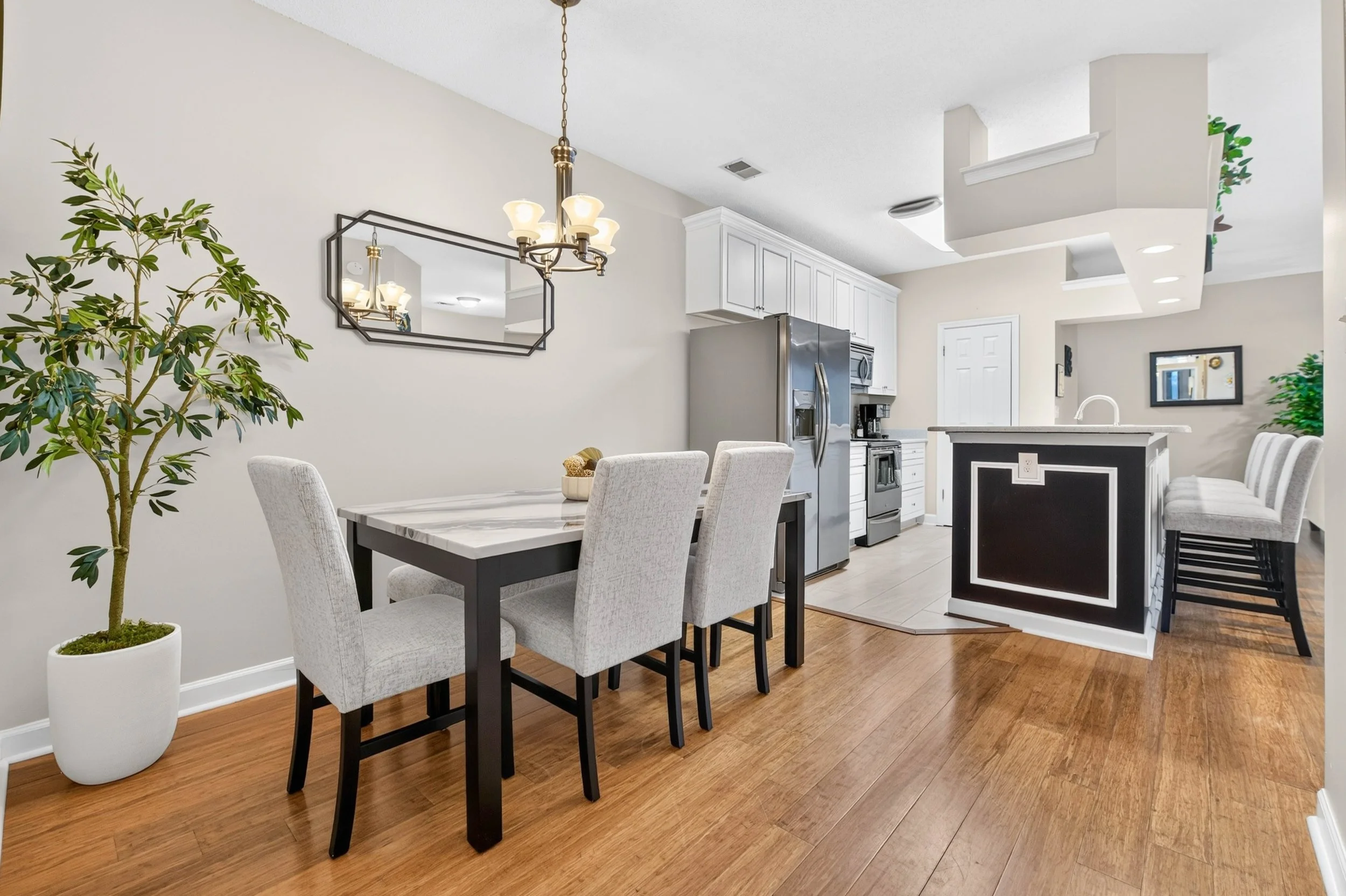 Positioned between the kitchen and living room, the dining area keeps meals and conversation at the center of the home.