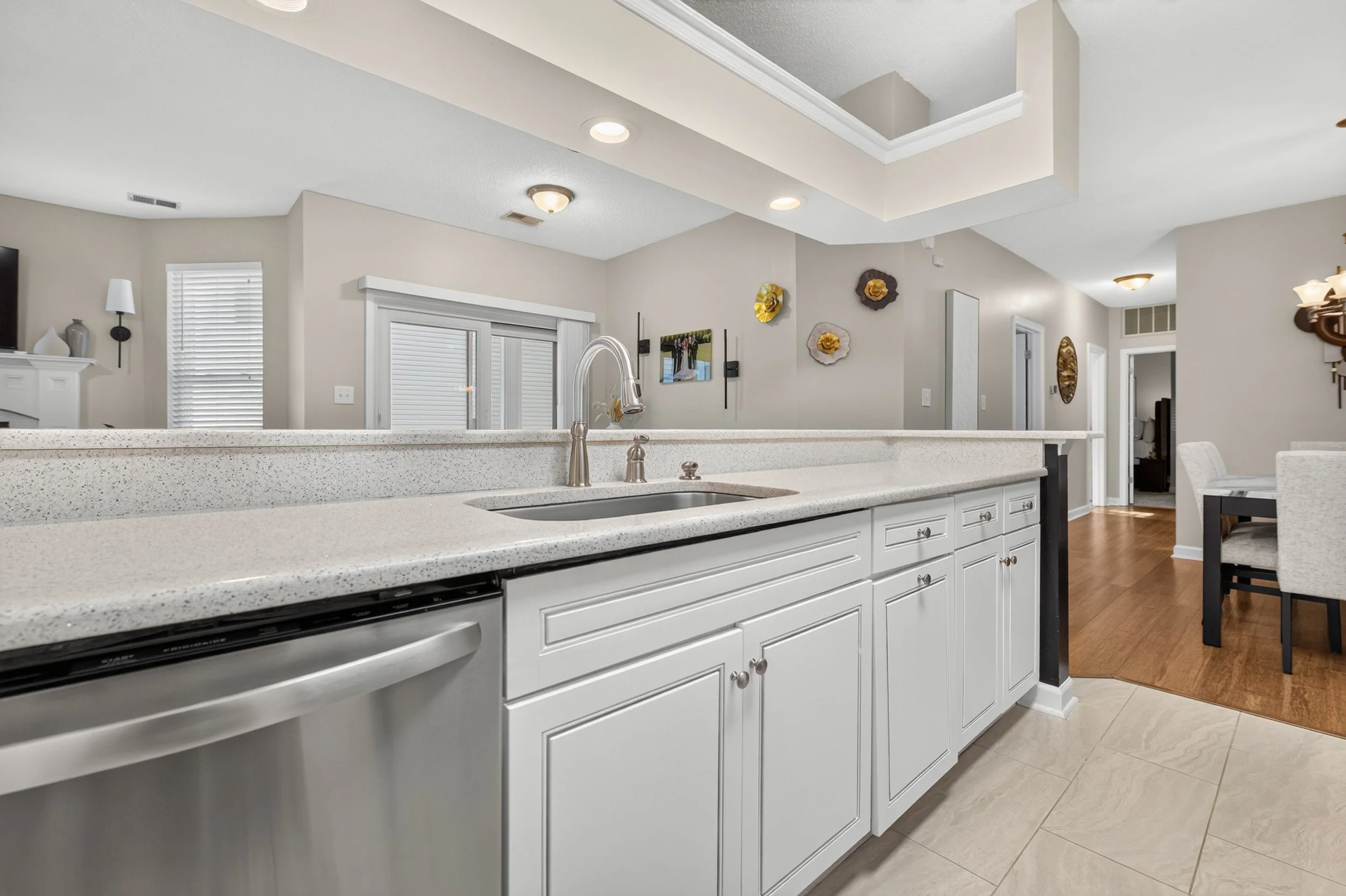 Expansive quartz counters provide plenty of room for meal preparation, serving and the routines of everyday life.