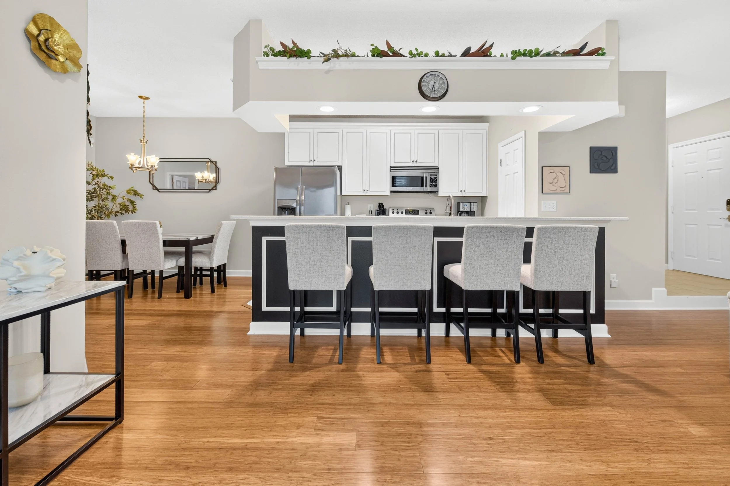 The kitchen peninsula creates an inviting spot for morning coffee, casual meals and conversation while dinner comes together.
