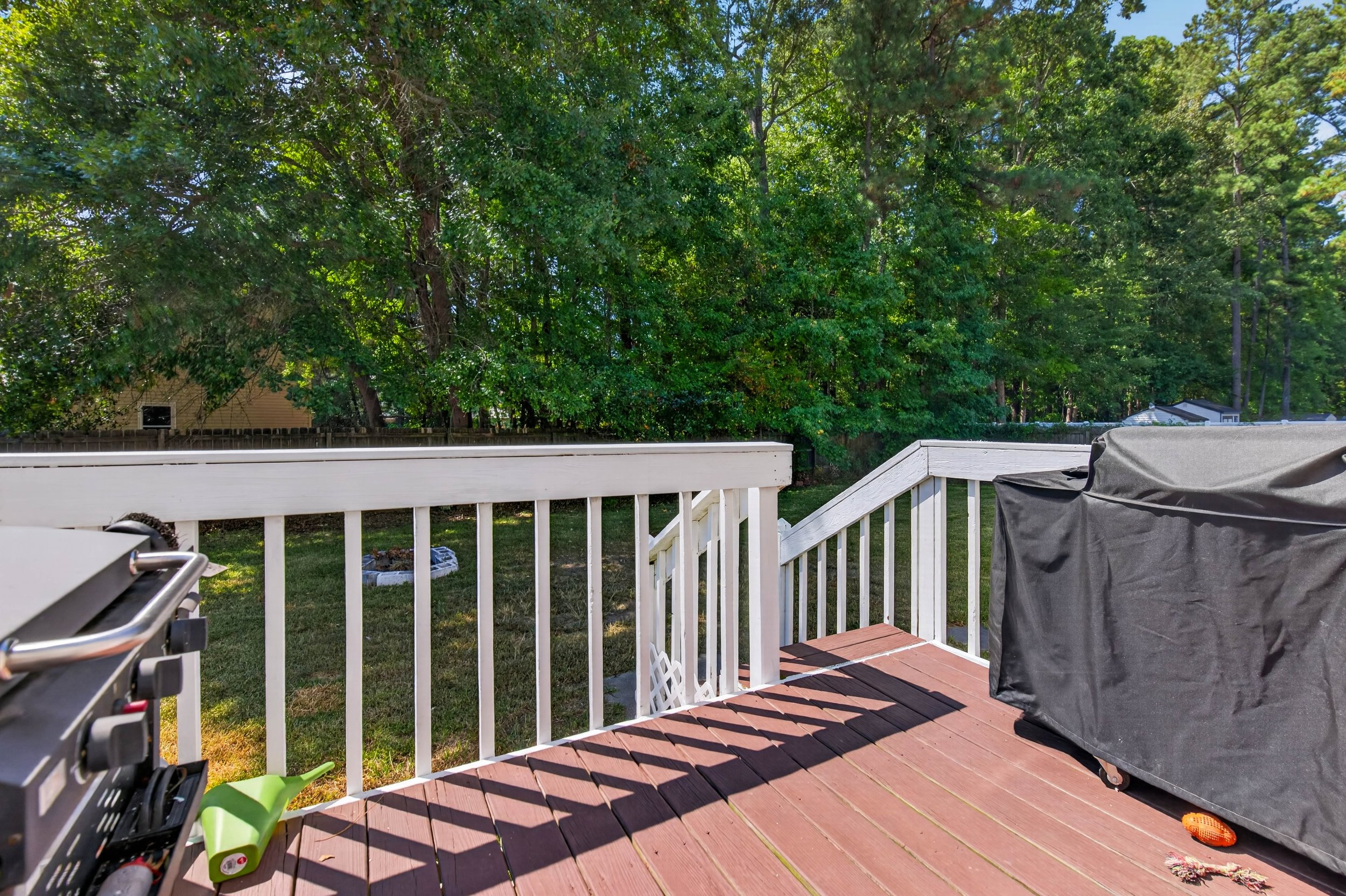 The rear deck creates an outdoor space just beyond the main living area.
