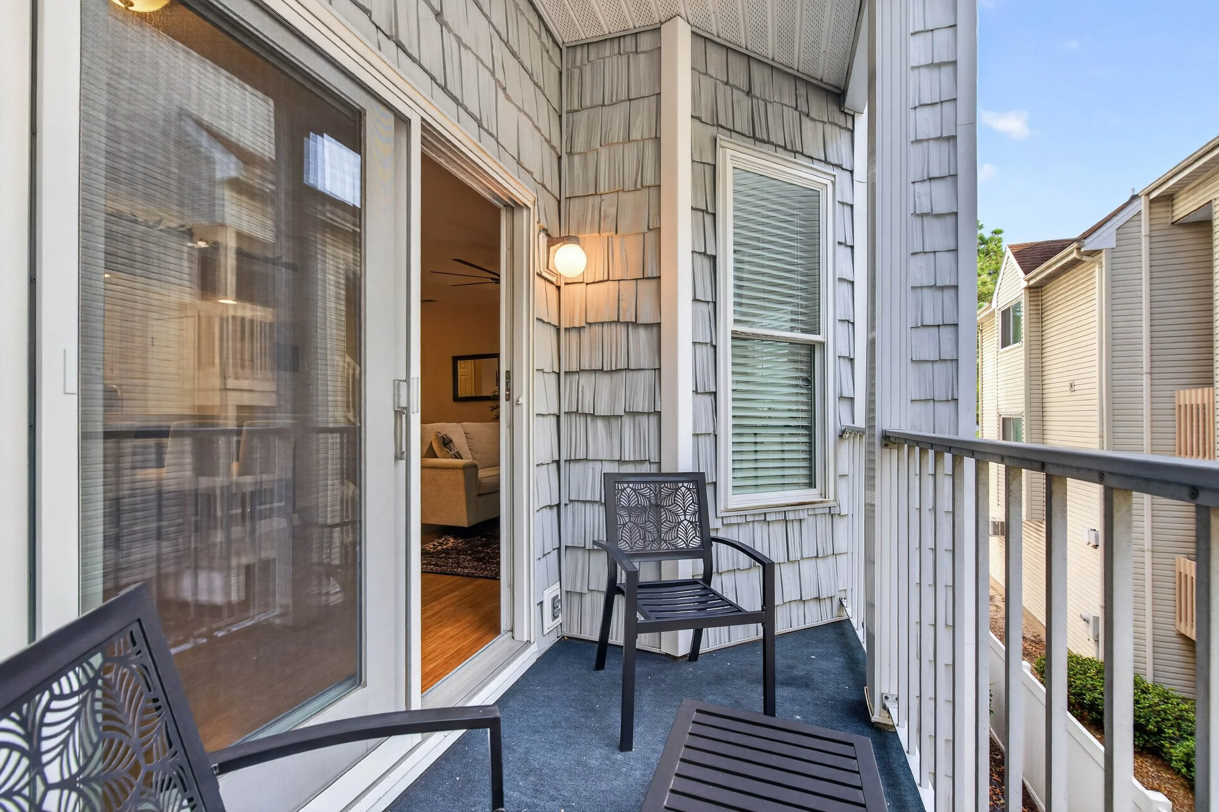 Just beyond the living room, the private balcony offers a spot for coffee, fresh air or a few quiet minutes.