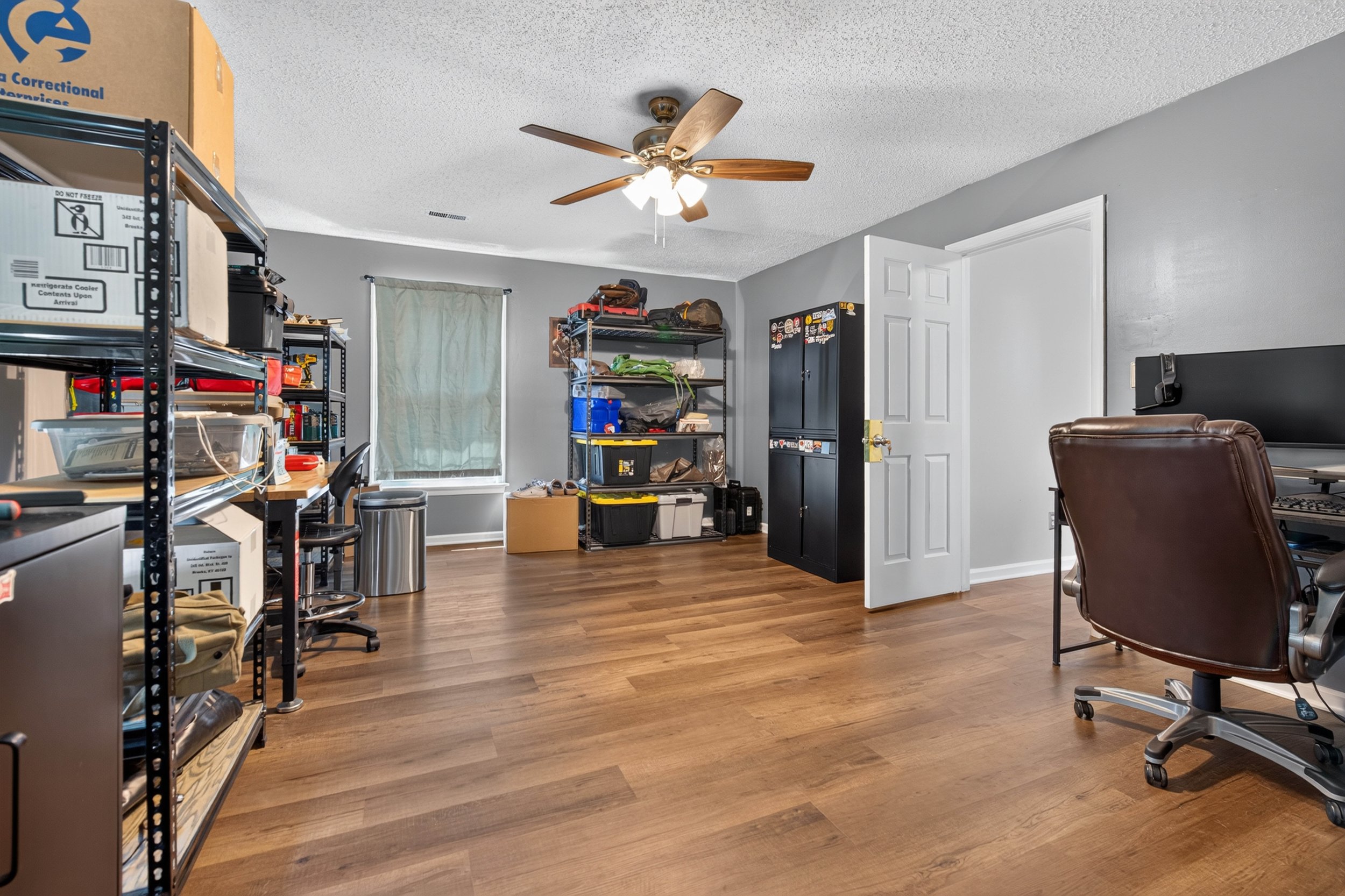 One upstairs bedroom is currently used as a home office, showing another option for the four-bedroom floor plan.