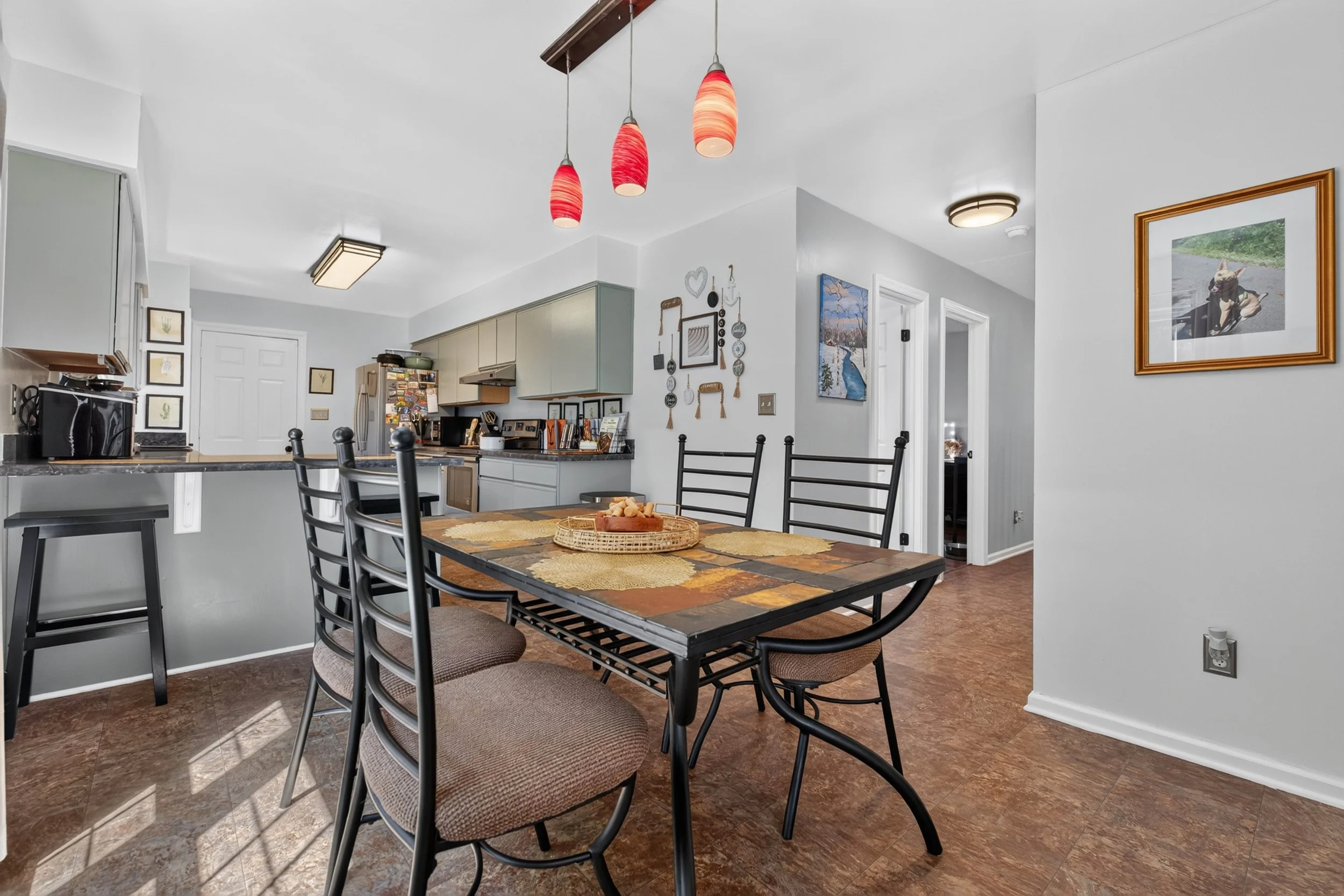 The dining area sits between the living room and kitchen, keeping both spaces close.