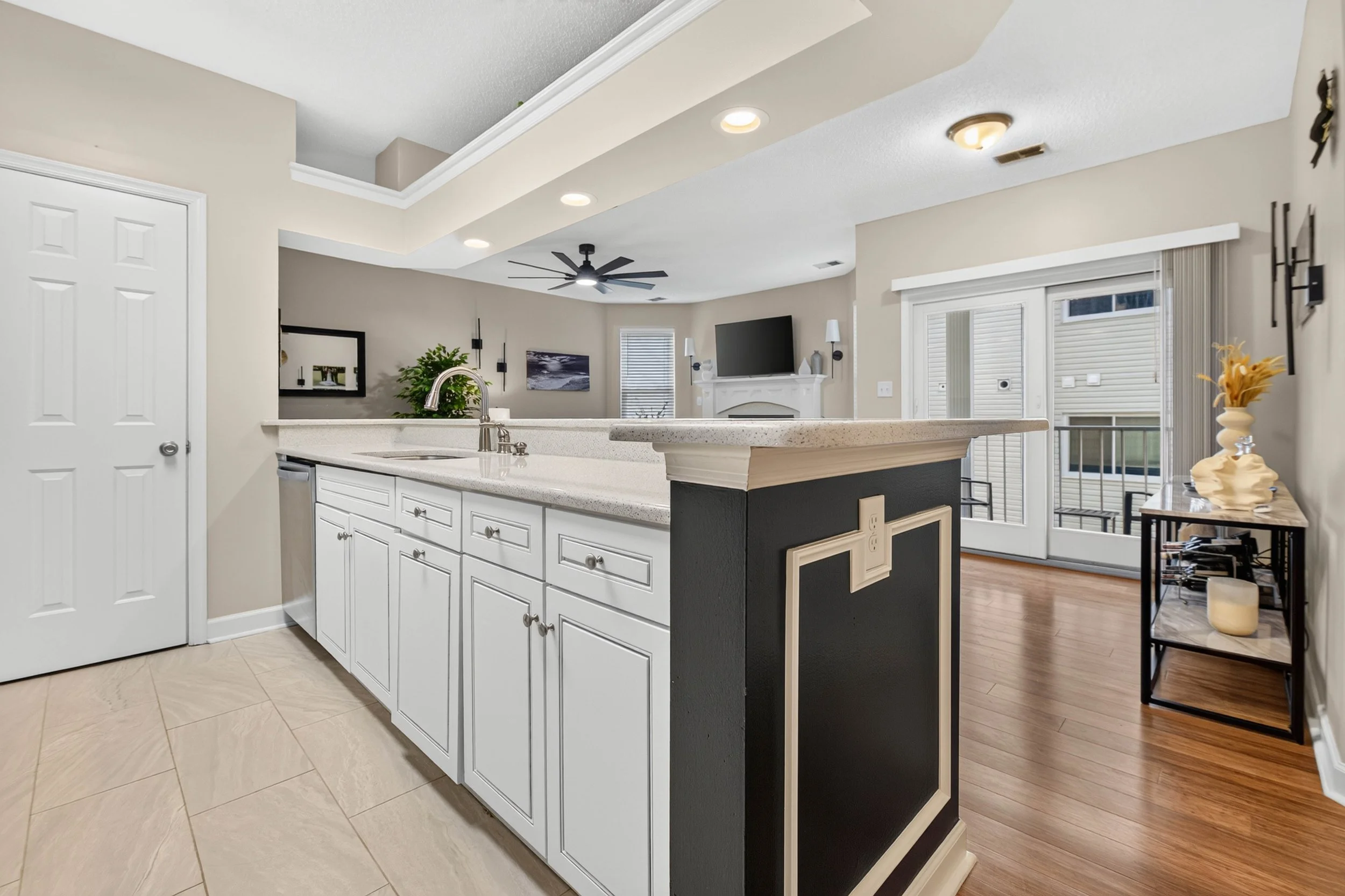 The open kitchen keeps the cook connected to the dining and living spaces while meals come together.