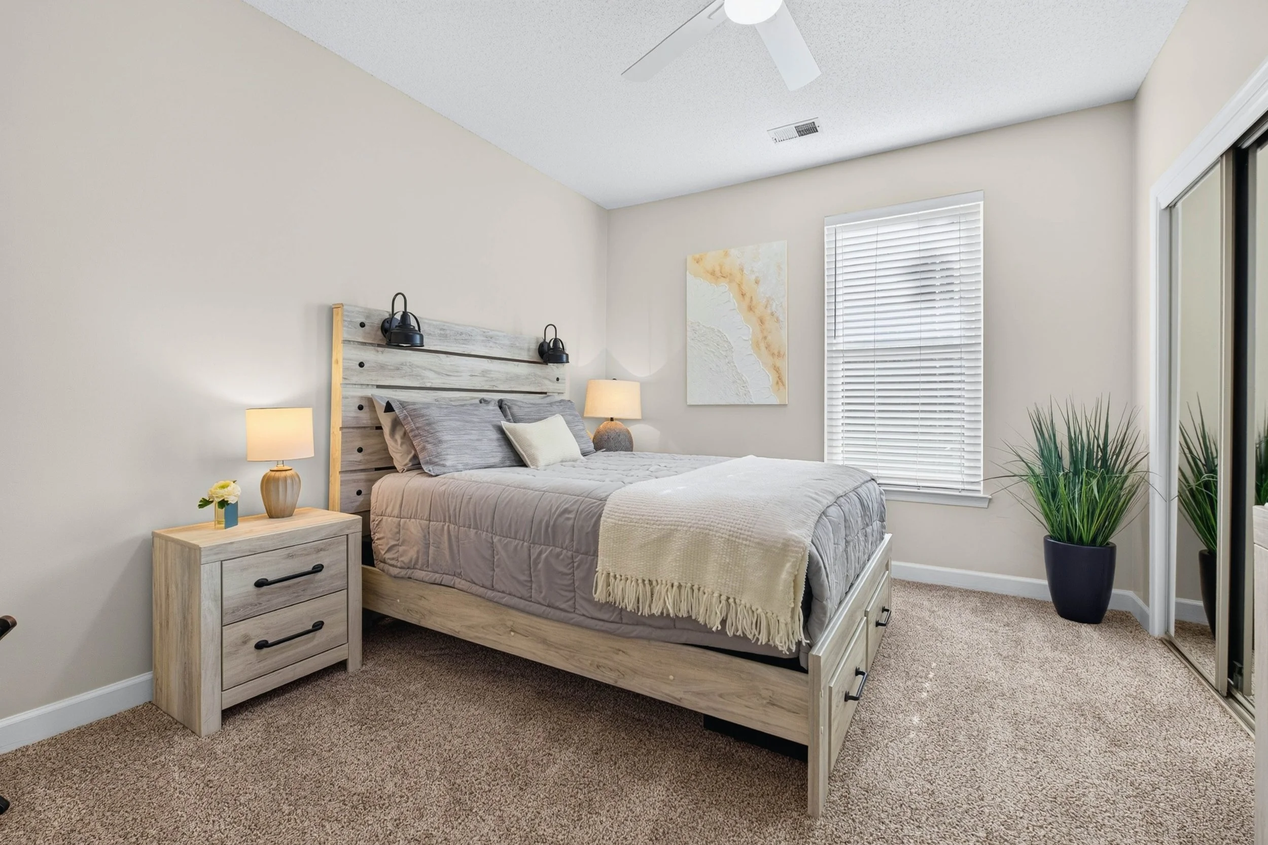 The second bedroom welcomes overnight guests with natural light, comfortable proportions and generous closet storage.
