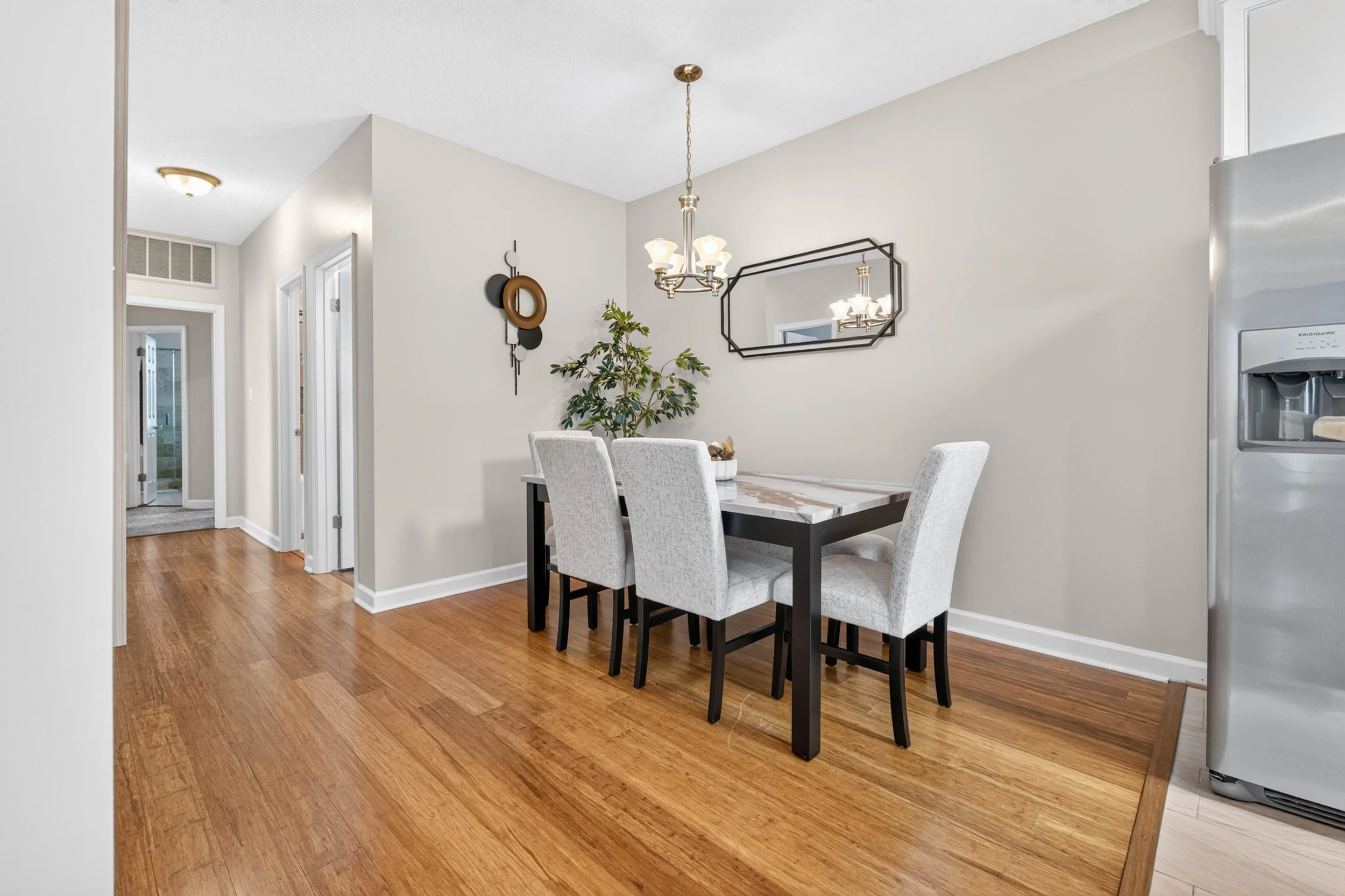 Open sightlines connect the kitchen, dining area and living room from the first cup of coffee through the end of the evening.