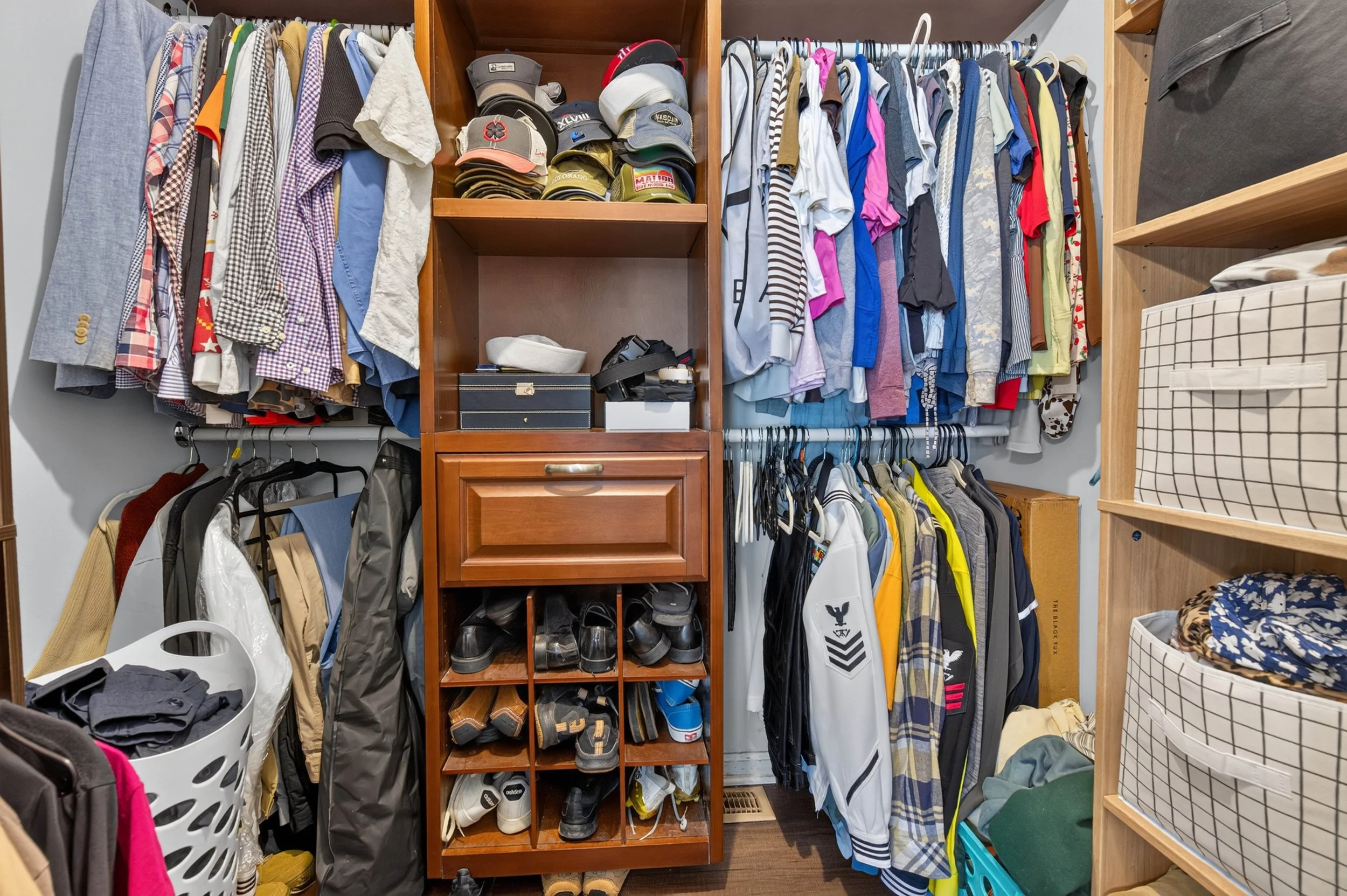 The walk-in closet provides dedicated storage for the first-floor primary bedroom.