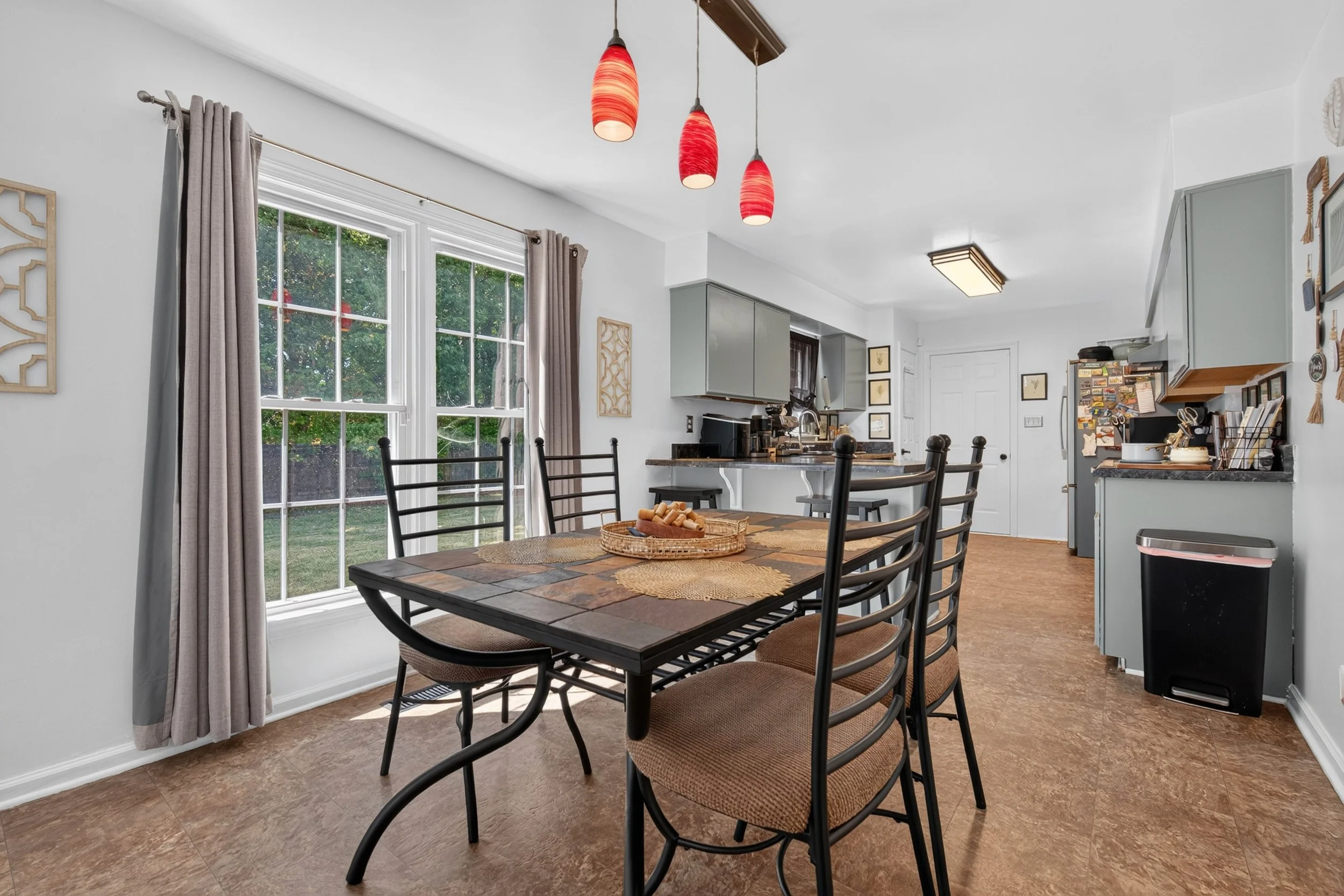 The dining area sits just outside the kitchen, keeping the two spaces connected while allowing each to remain its own room.