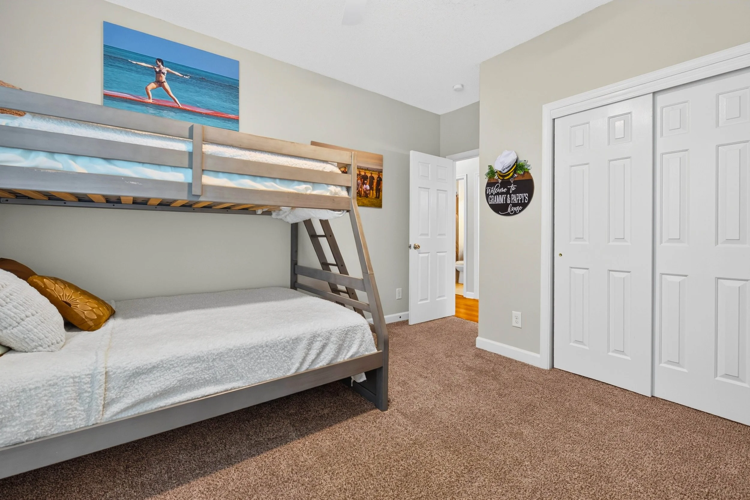 A wall of closet storage supports the third bedroom’s flexibility while keeping belongings neatly out of sight.