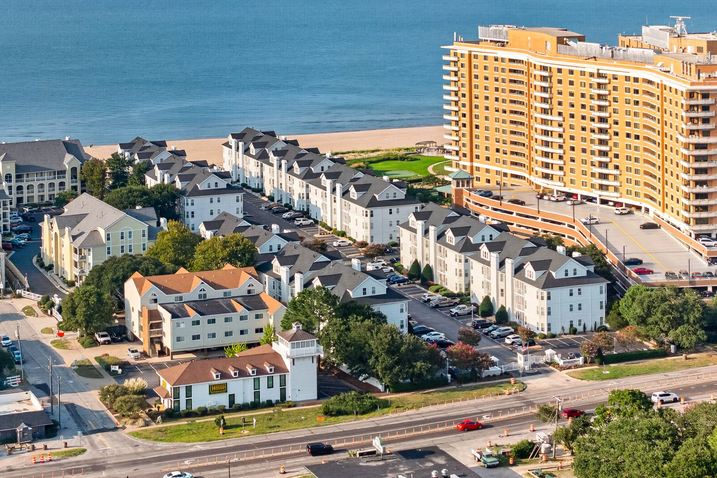 Homes, beach and Bay share the frame, illustrating the coastal connection that makes Lynnhaven Beach distinctive.