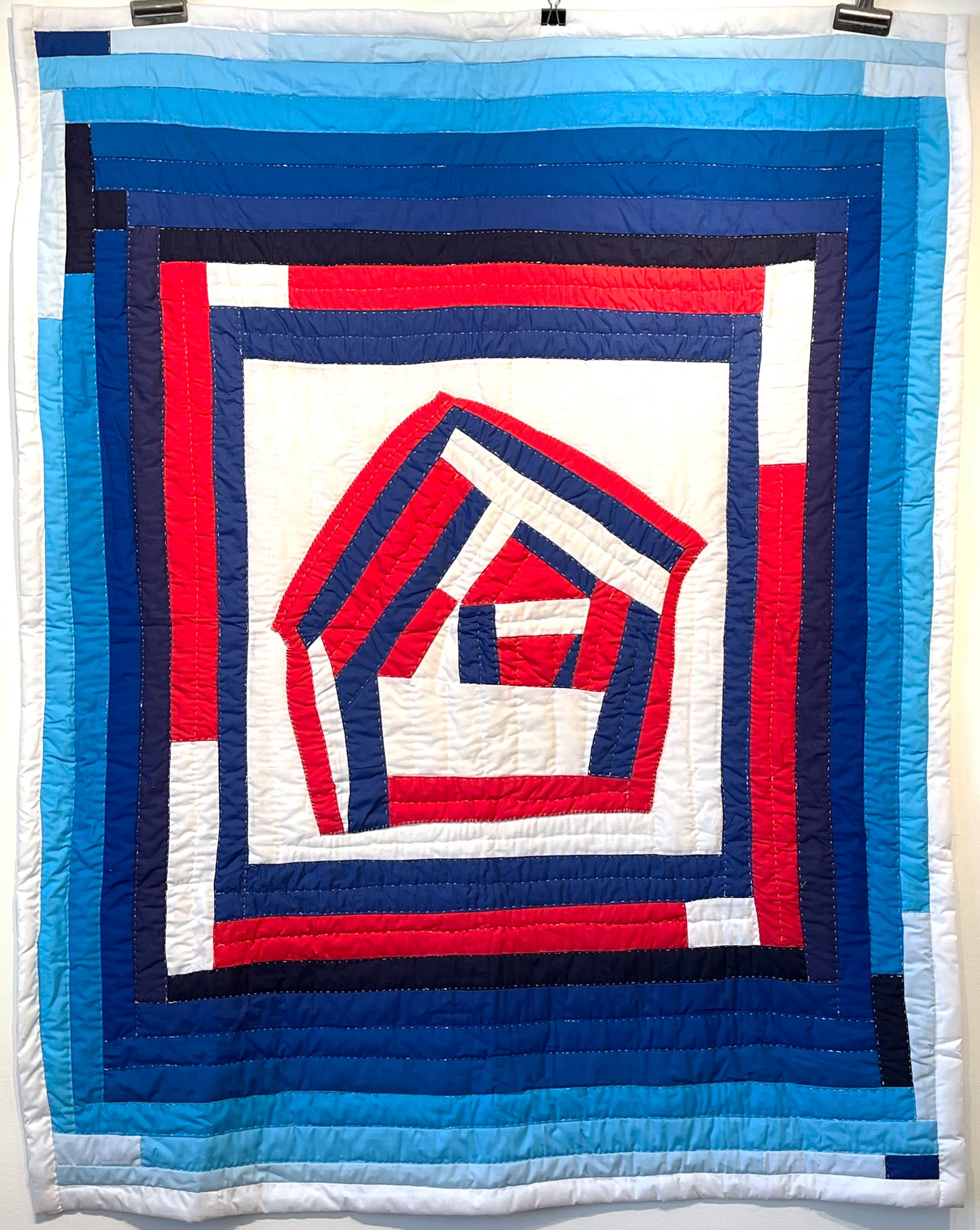   Joeann West (Gee’s Bend, AL)    “America Still Standing”, 2022   60” x 48”, cotton fabrics  Hand-quilted    ASK ABOUT THIS QUILT   