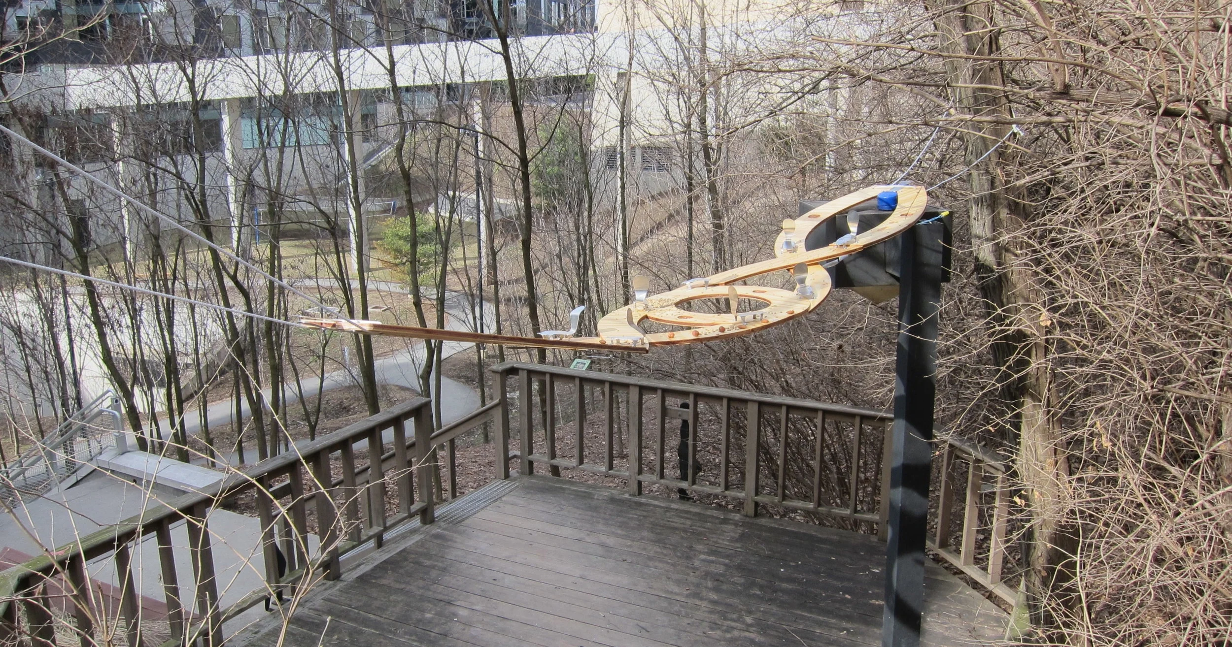 CNC routed plywood, squirrel shaped aluminum brackets, rope, assorted nuts 