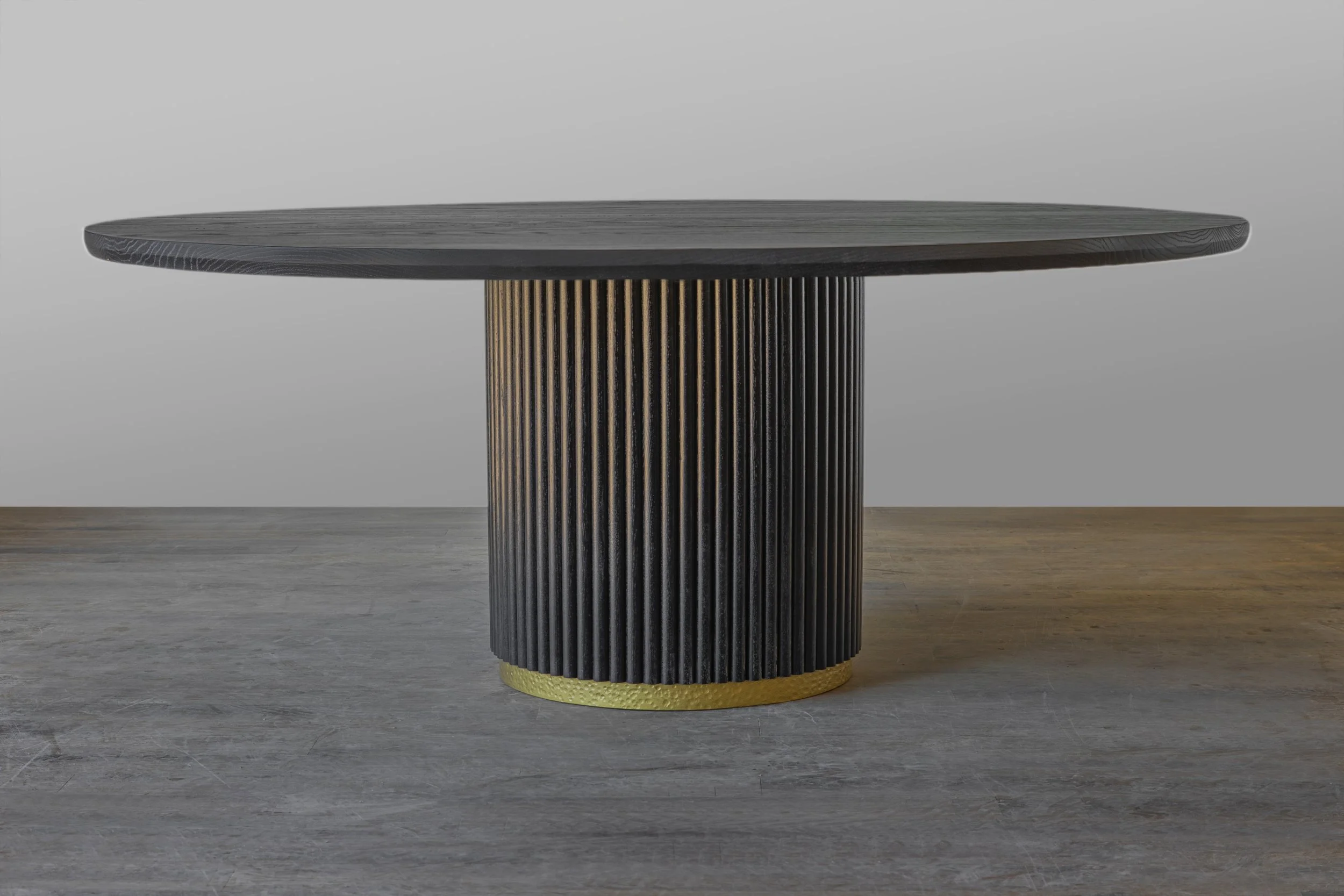 Olivia reeded dining table in ebonized oak with gold accents