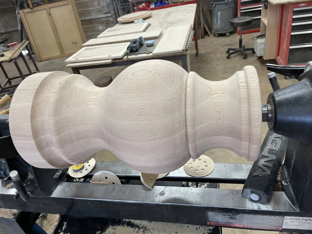 An newly completed oak pedestal on the lathe