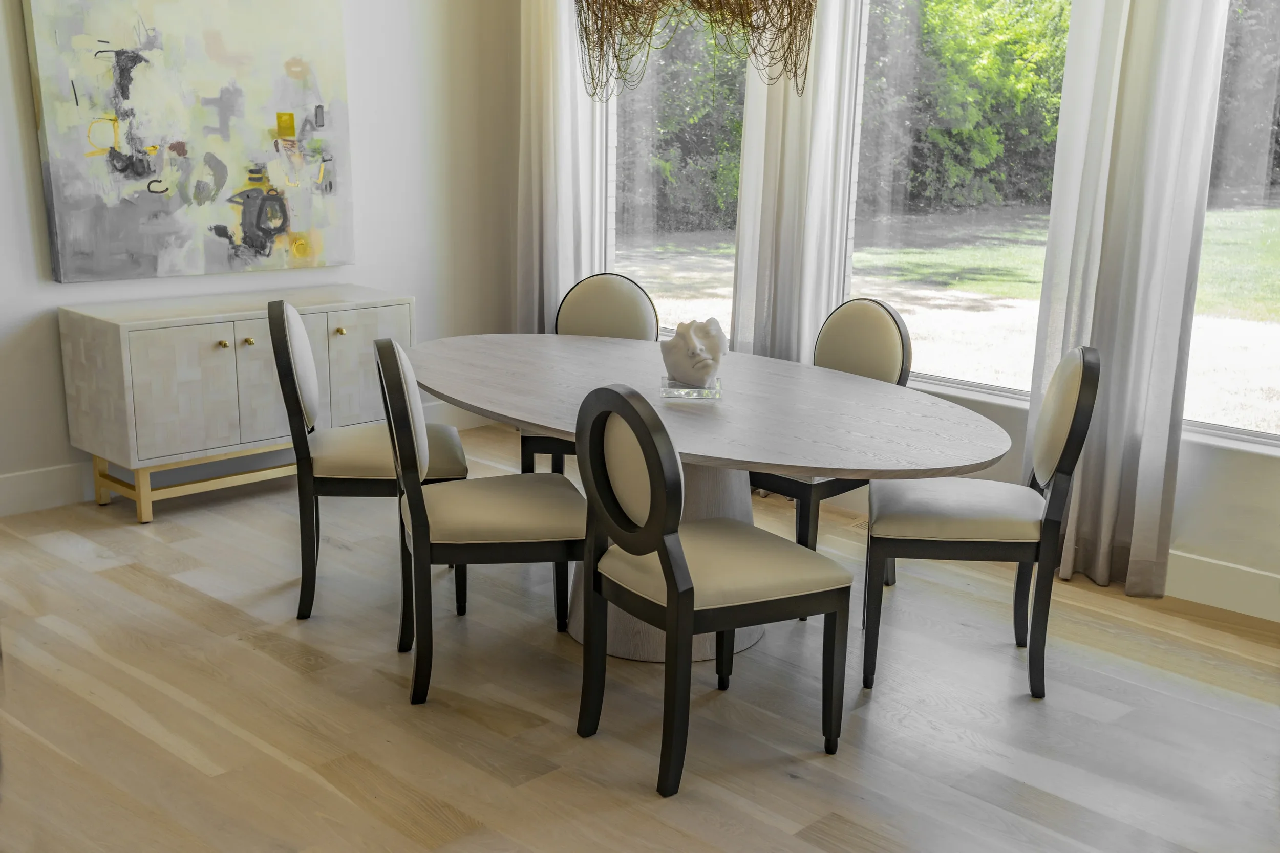 Custom Sophia table and black lacquered chairs
