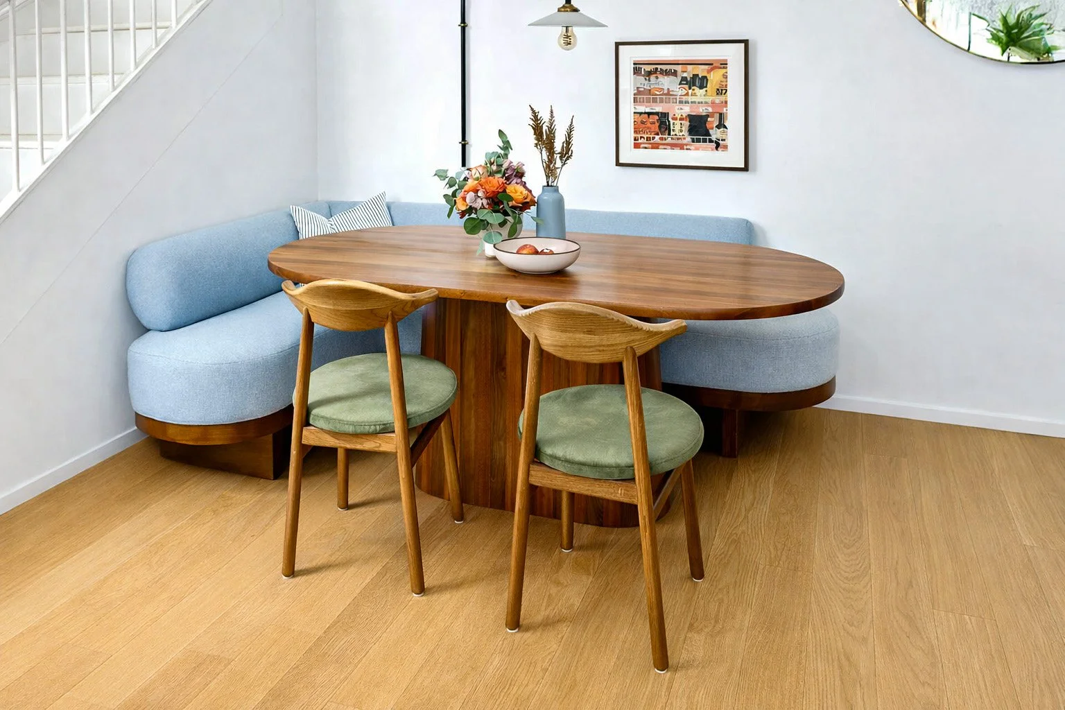 A pill shaped dining table in a Tulsa, Oklahoma banquette