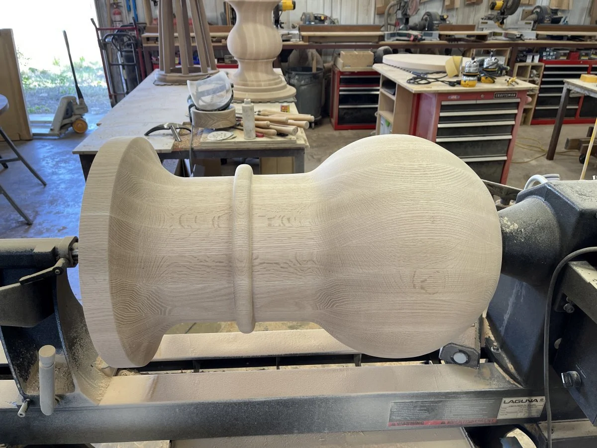 An newly completed oak pedestal on the lathe