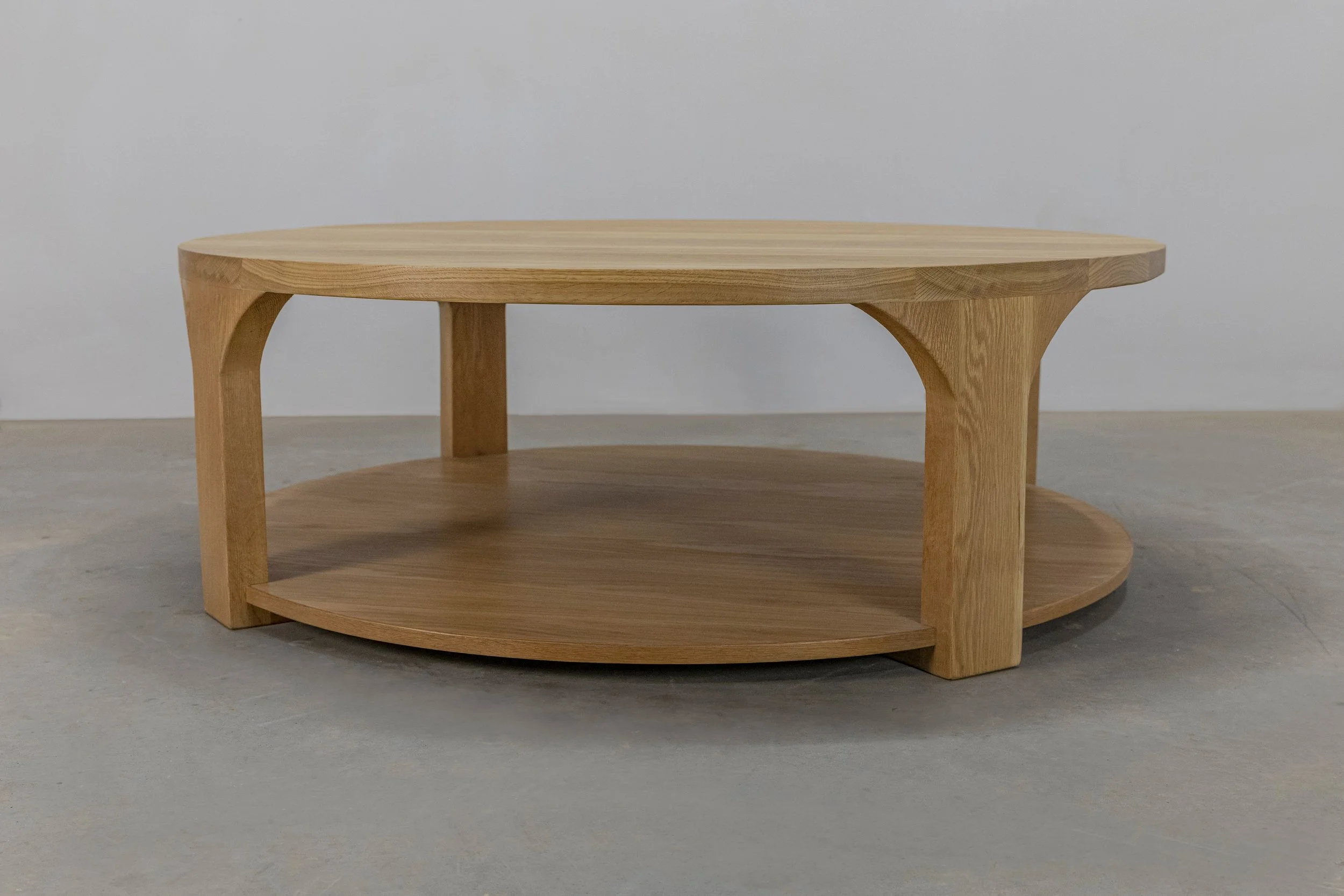 Round white oak coffee table with shelf