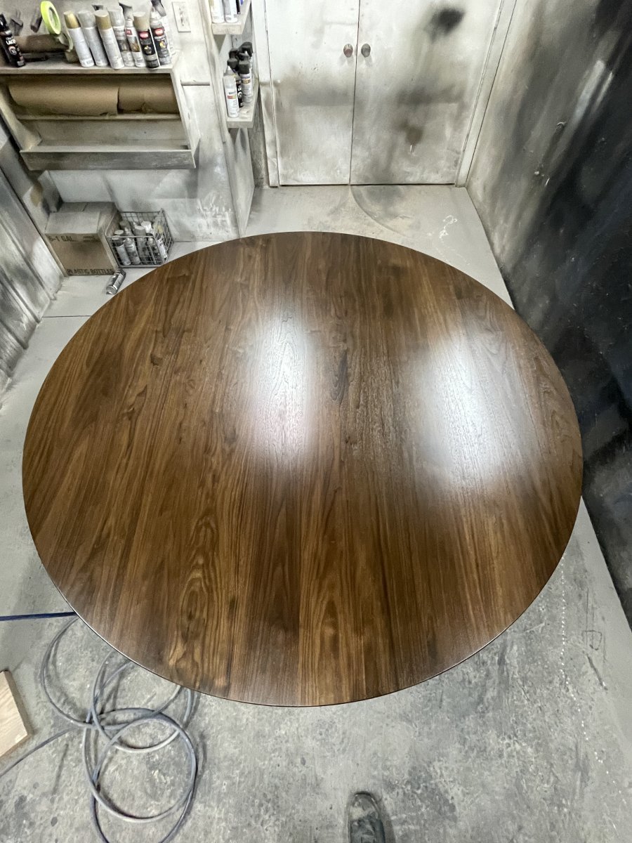 A Solid Walnut tabletop after its second coat of catalyzed lacquer