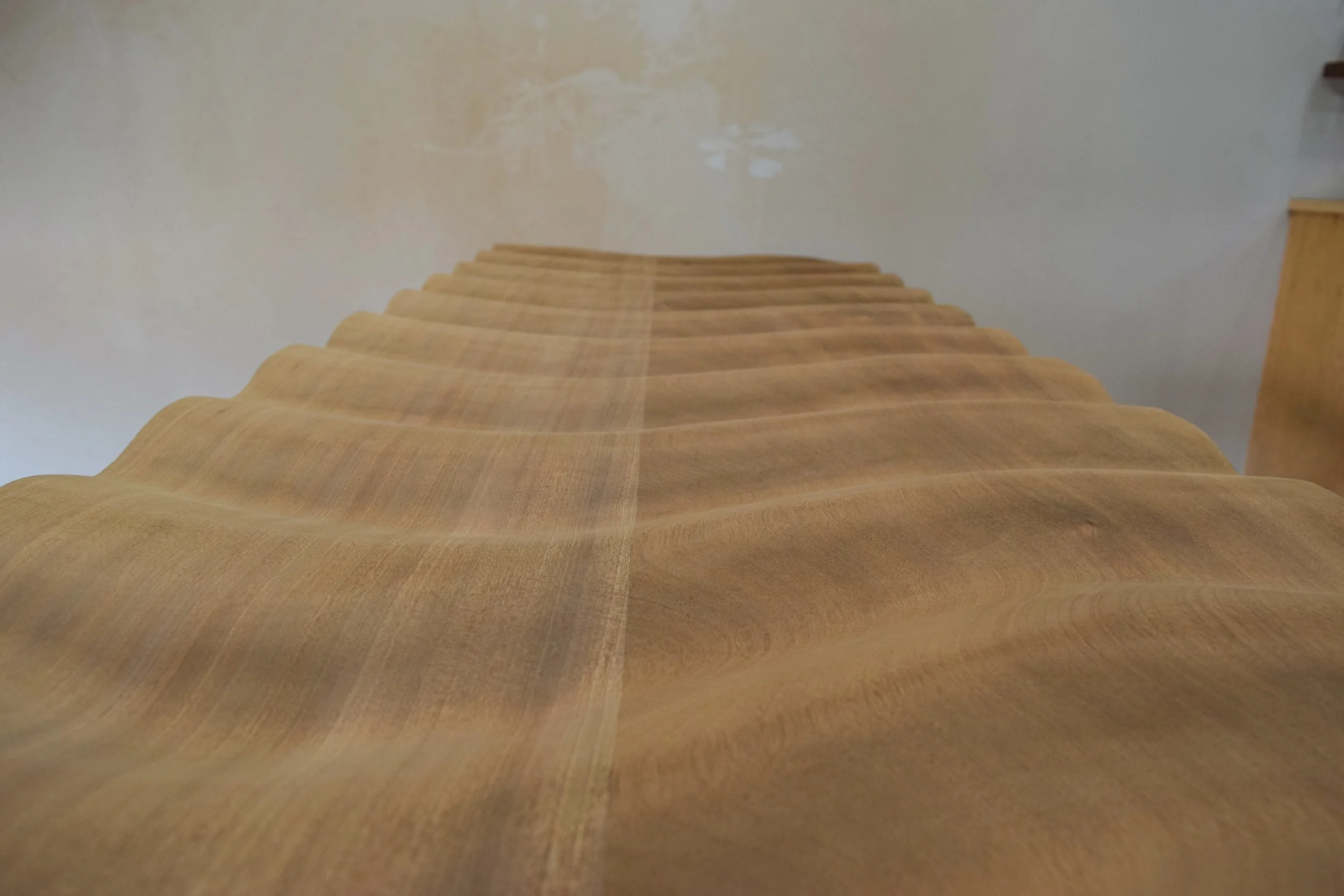 Carved front of the wave face console