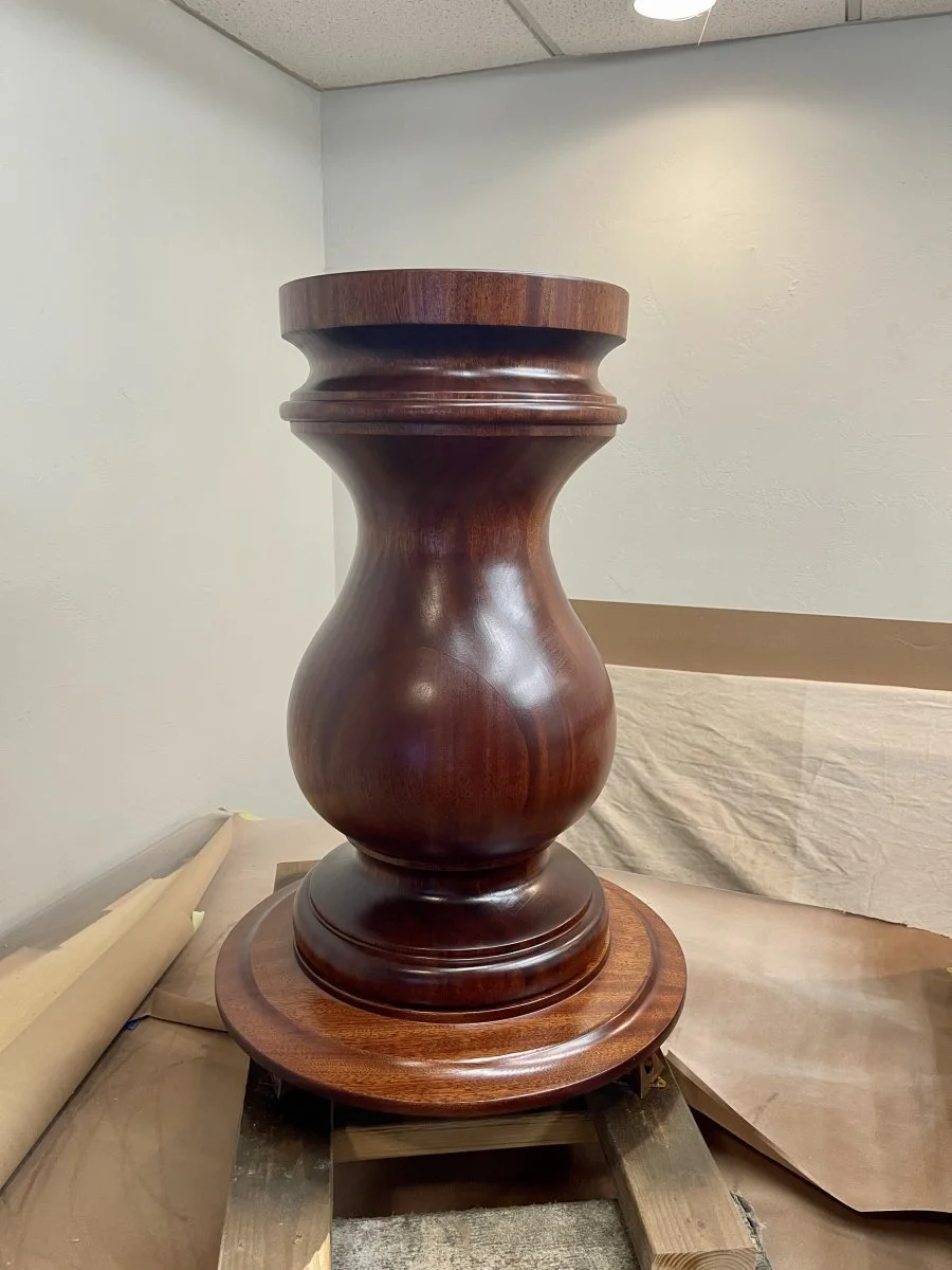 A solid Mahogany pedestal after its final coat of catalyzed lacquer