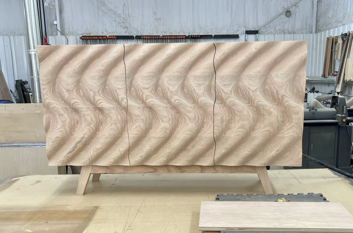 One of out wave face credenzas after its final shaping and rough sanding, about to go through its long final sanding process