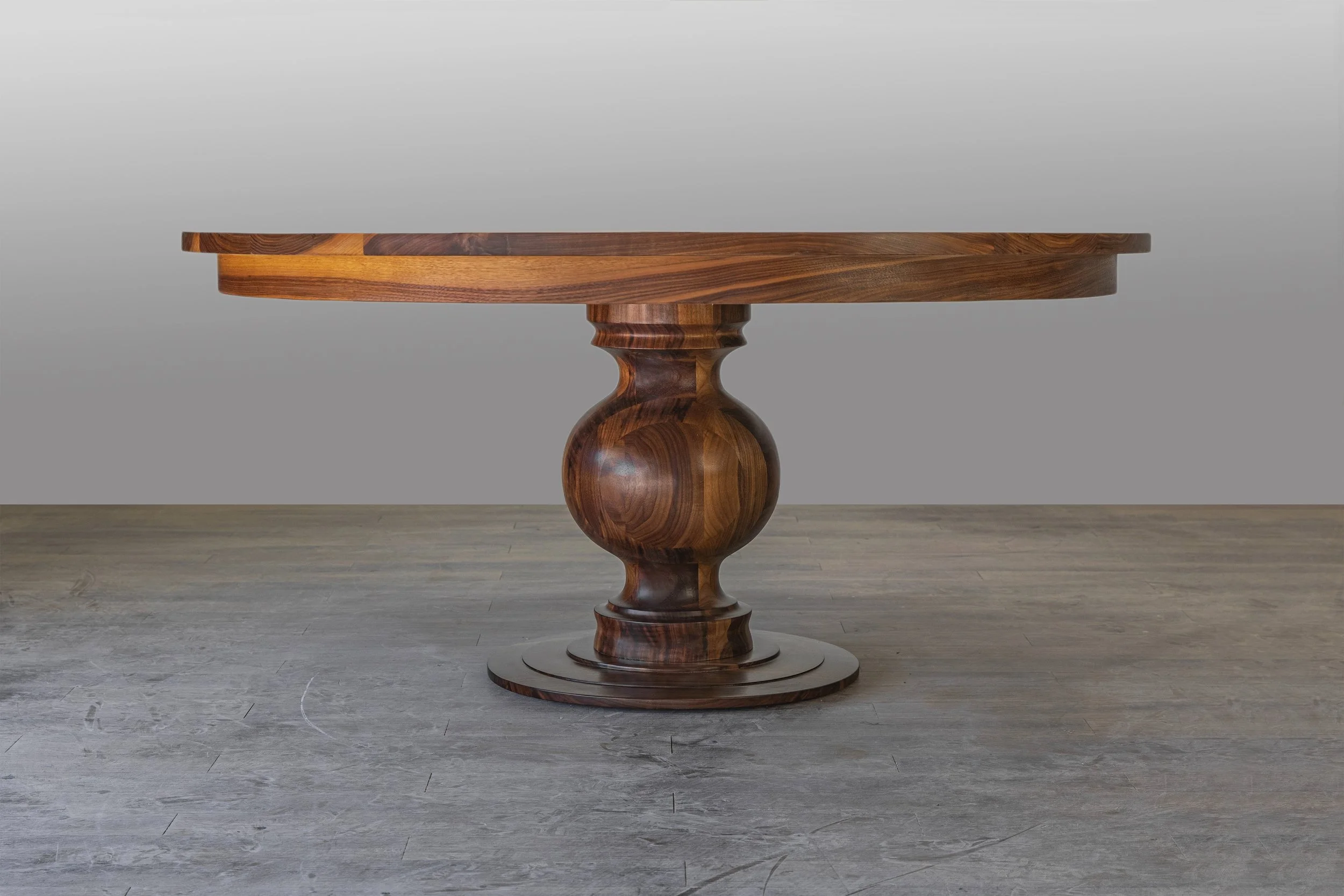 A Walnut Grace dining table with natural finish