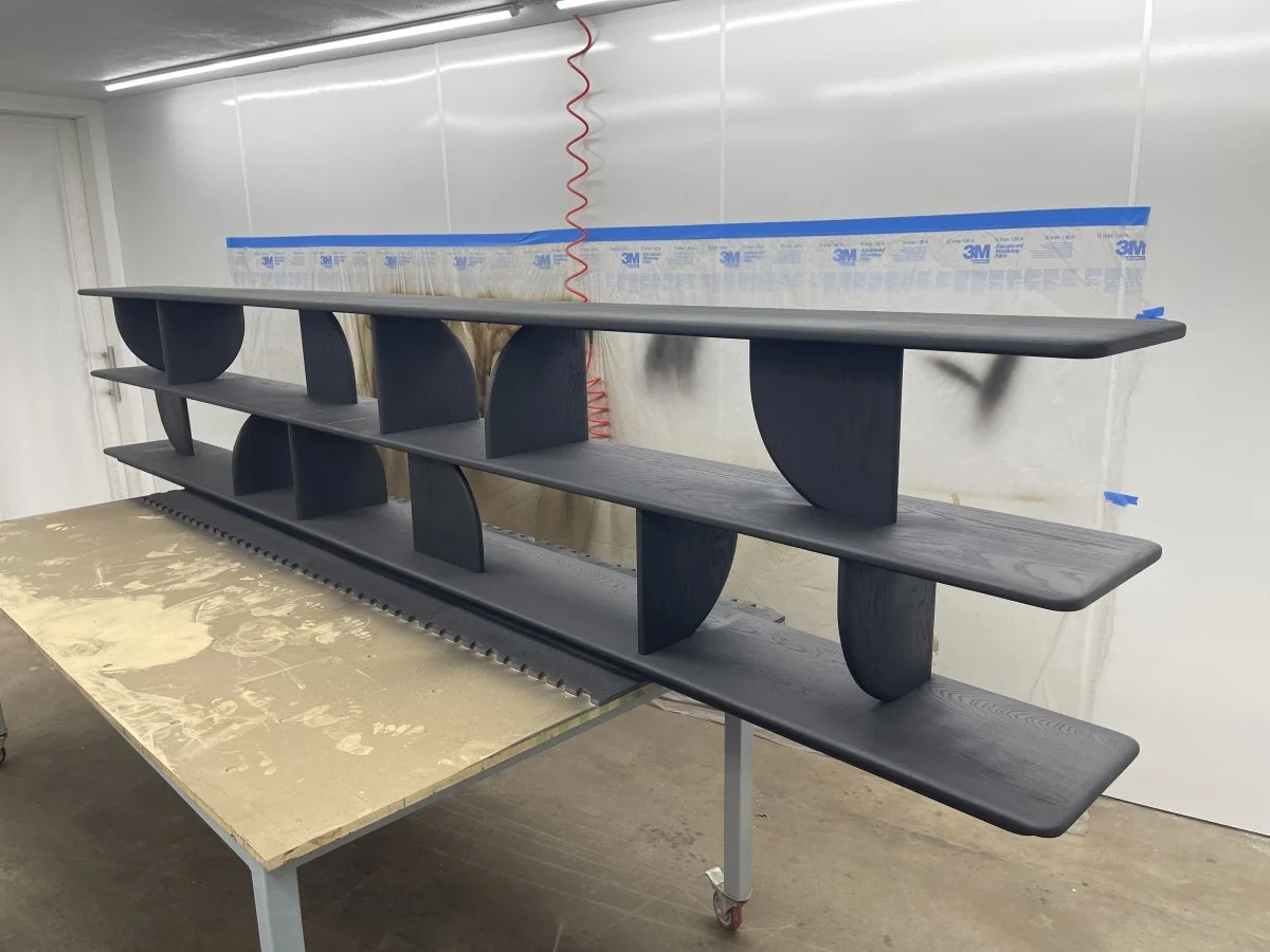 A large white oak bookcase after ebonizing and its first coat of matte finish