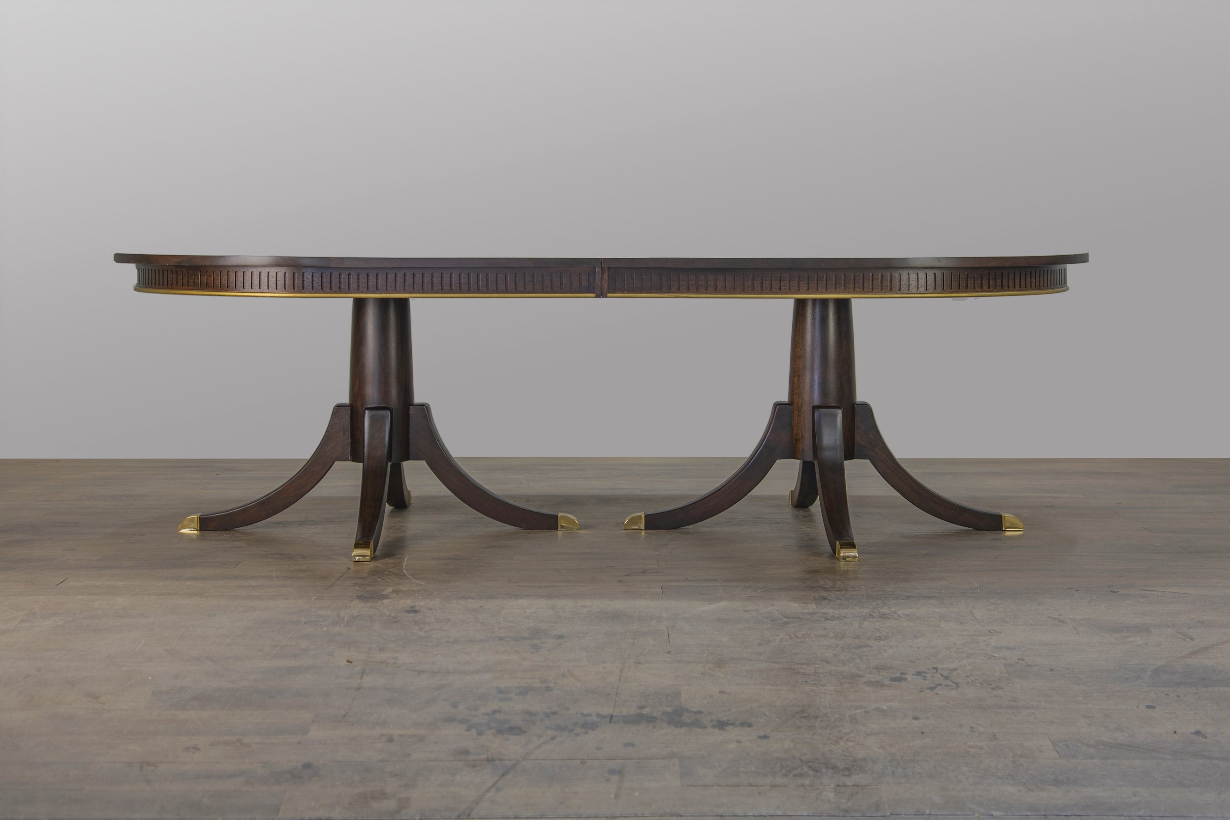 The custom designed Phyfe dining table seen in solid mahogany, in Oklahoma City