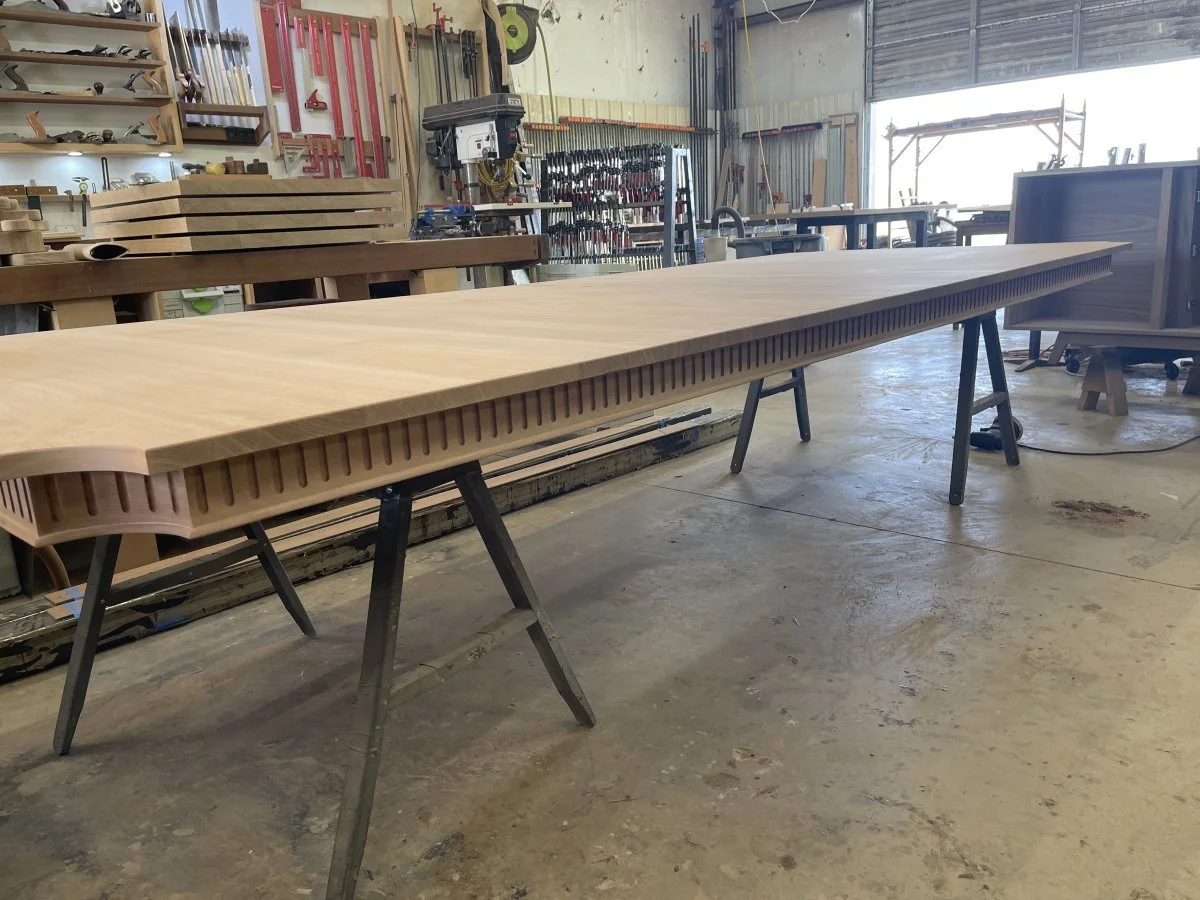 Two halves of a Phyfe tabletop being fitted together