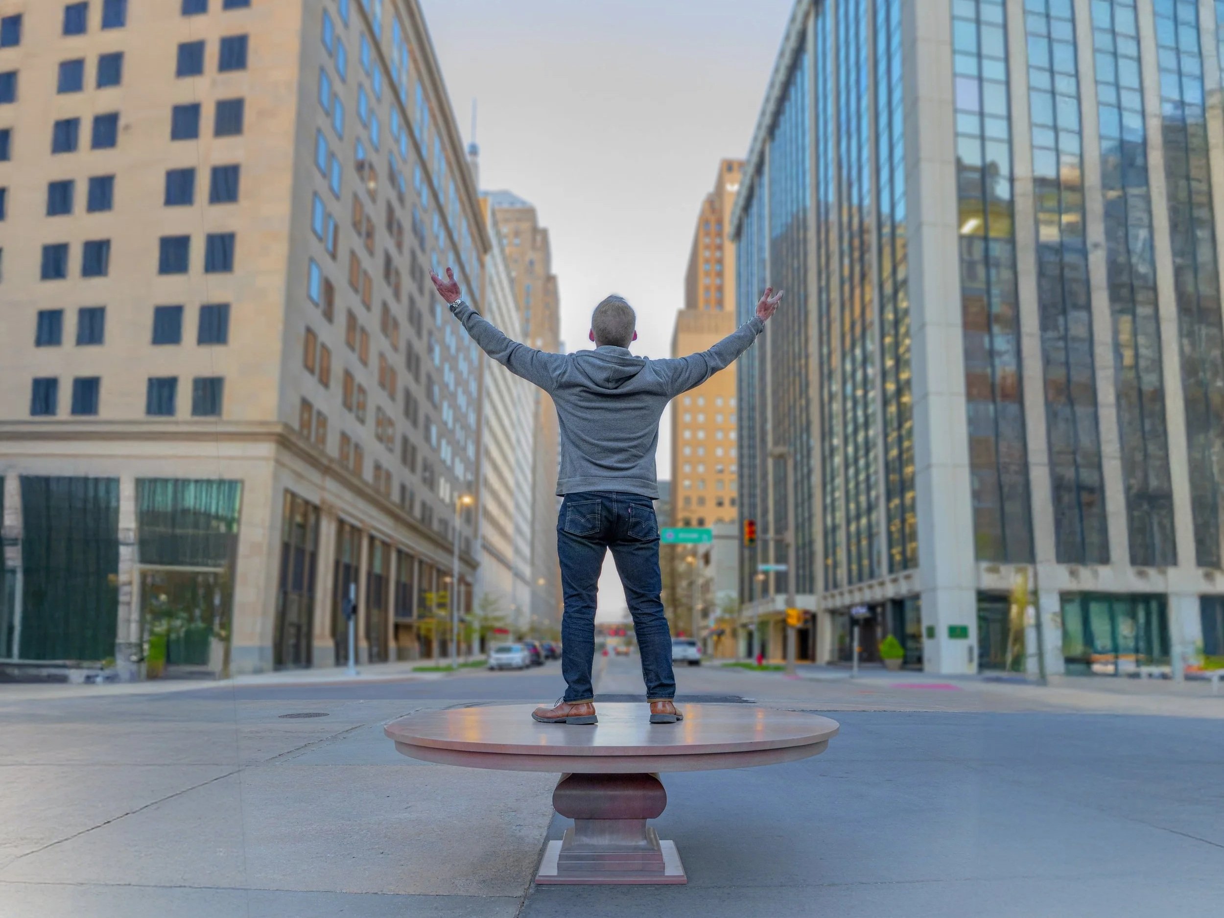 william graeber standing on a tabletop in downtown oklahoma city