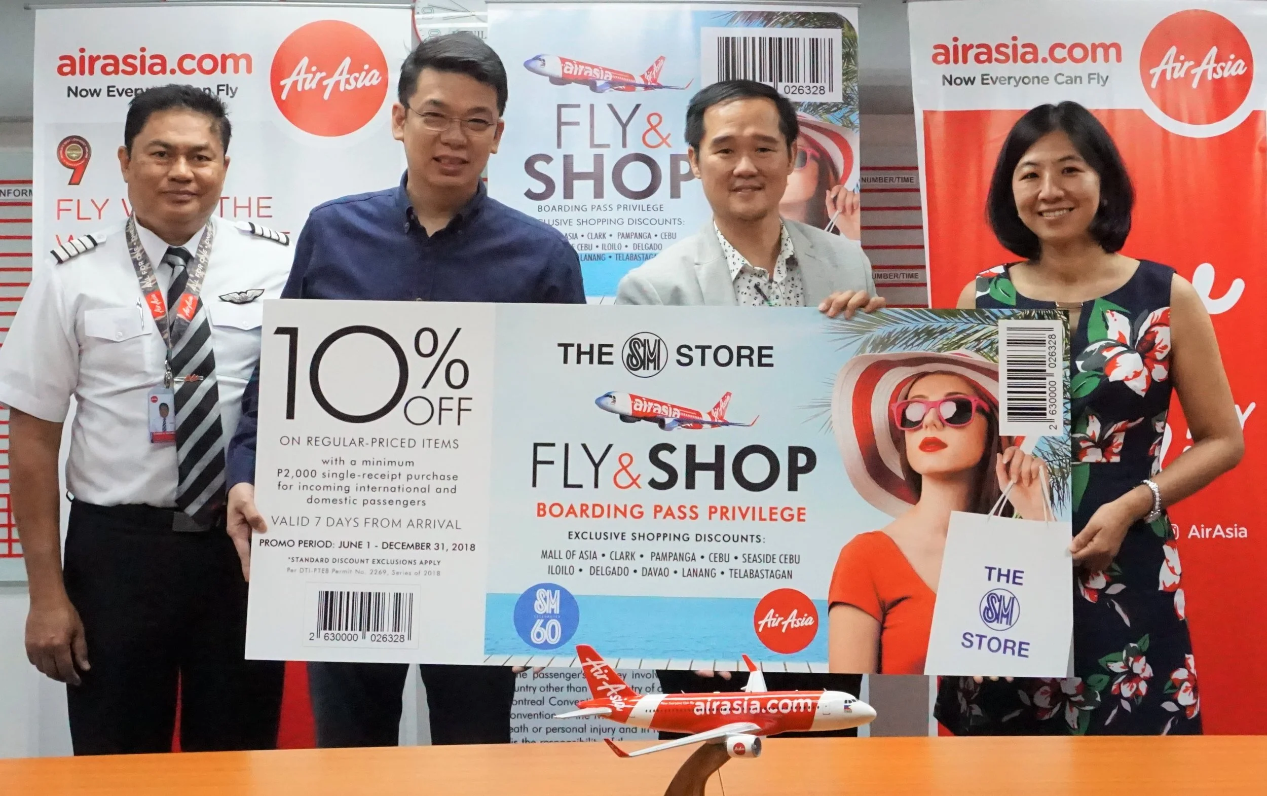 Caption (L-R) AirAsia Philippines Director for flight operations Captain Gomer Monreal, AirAsia Philippines Commercial Director Gilbert Simpao, The SM Store SVP Eugene Saw and The SM Store VP Quennielyn Cua.