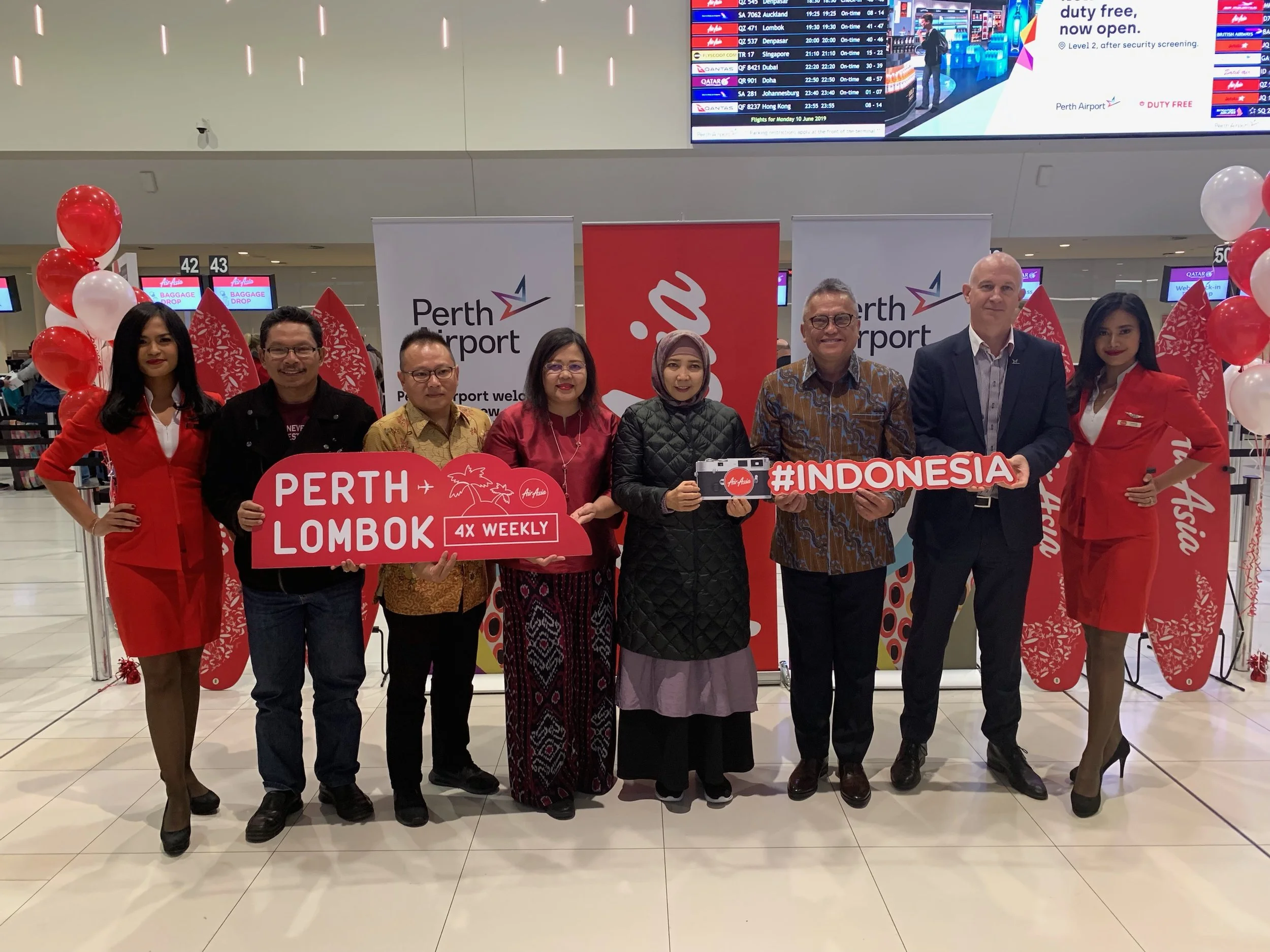 Photo Caption (From Left): Rosiady Sayuti, Provincial Secretary of West Nusa Tenggara Province, Indonesia; Rifai Taberi, Commercial Director of AirAsia Indonesia; Dewi Tobing, Consul General of the Republic of Indonesia in Perth; Sitti Rohmi Djalilah, Vice Governor of West Nusa Tenggara Province, Indonesia; Robert Waloni, Senior Adviser to the Minister for Air Accessibility, Ministry of Tourism Republic Indonesia and Kevin Brown, Perth Airport CEO flanked by cabin crew