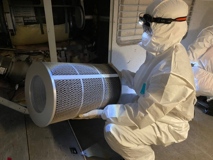 Ground crew replacing the HEPA filter of the aircraft