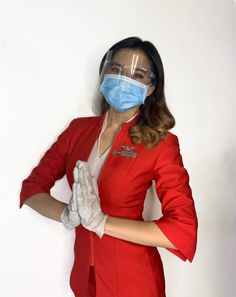 AirAsia cabin crew in her personal protective equipment.