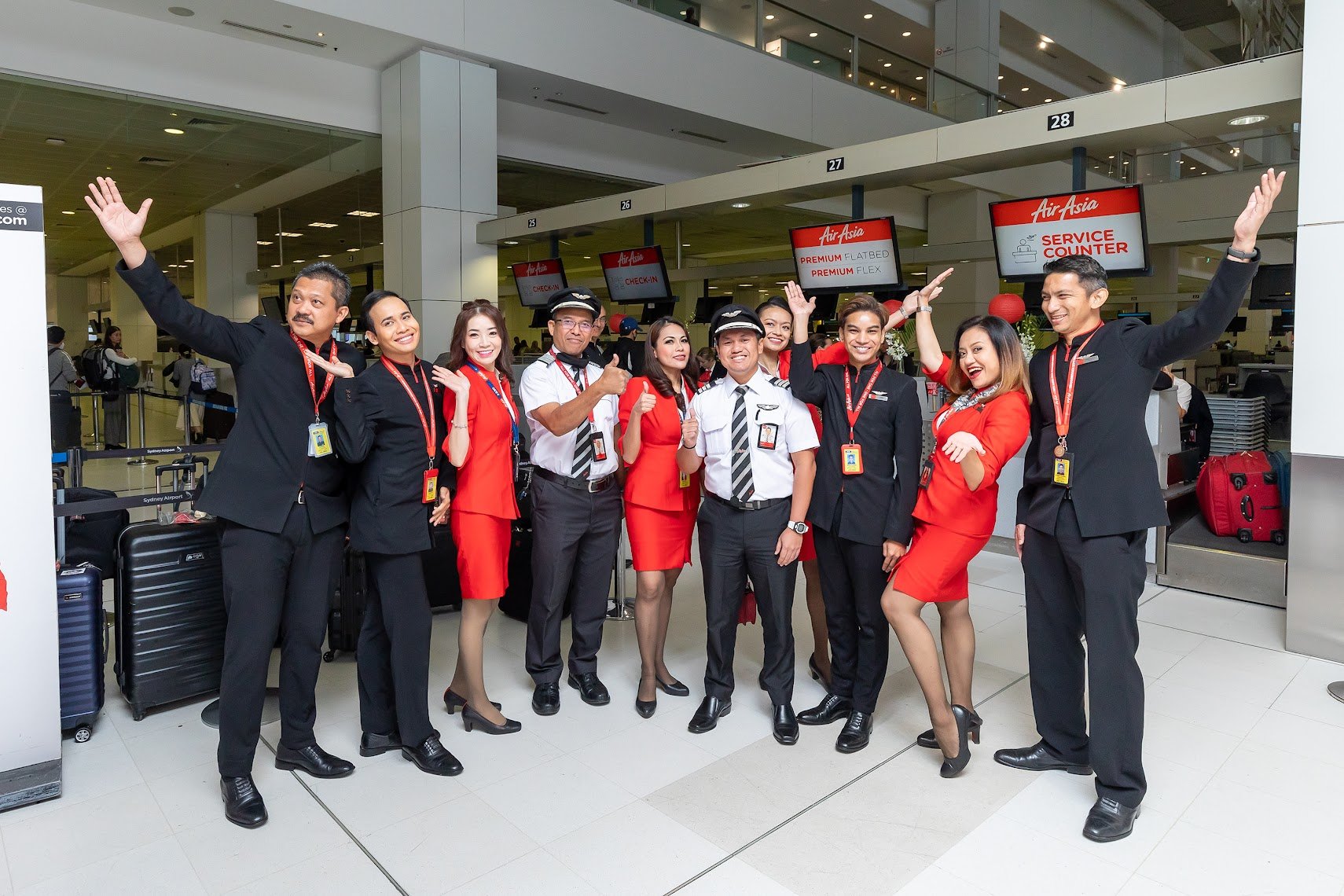  Photo Caption: AirAsia X Cabin Crew at Sydney Airport.  Photo by © Kurt Ams 