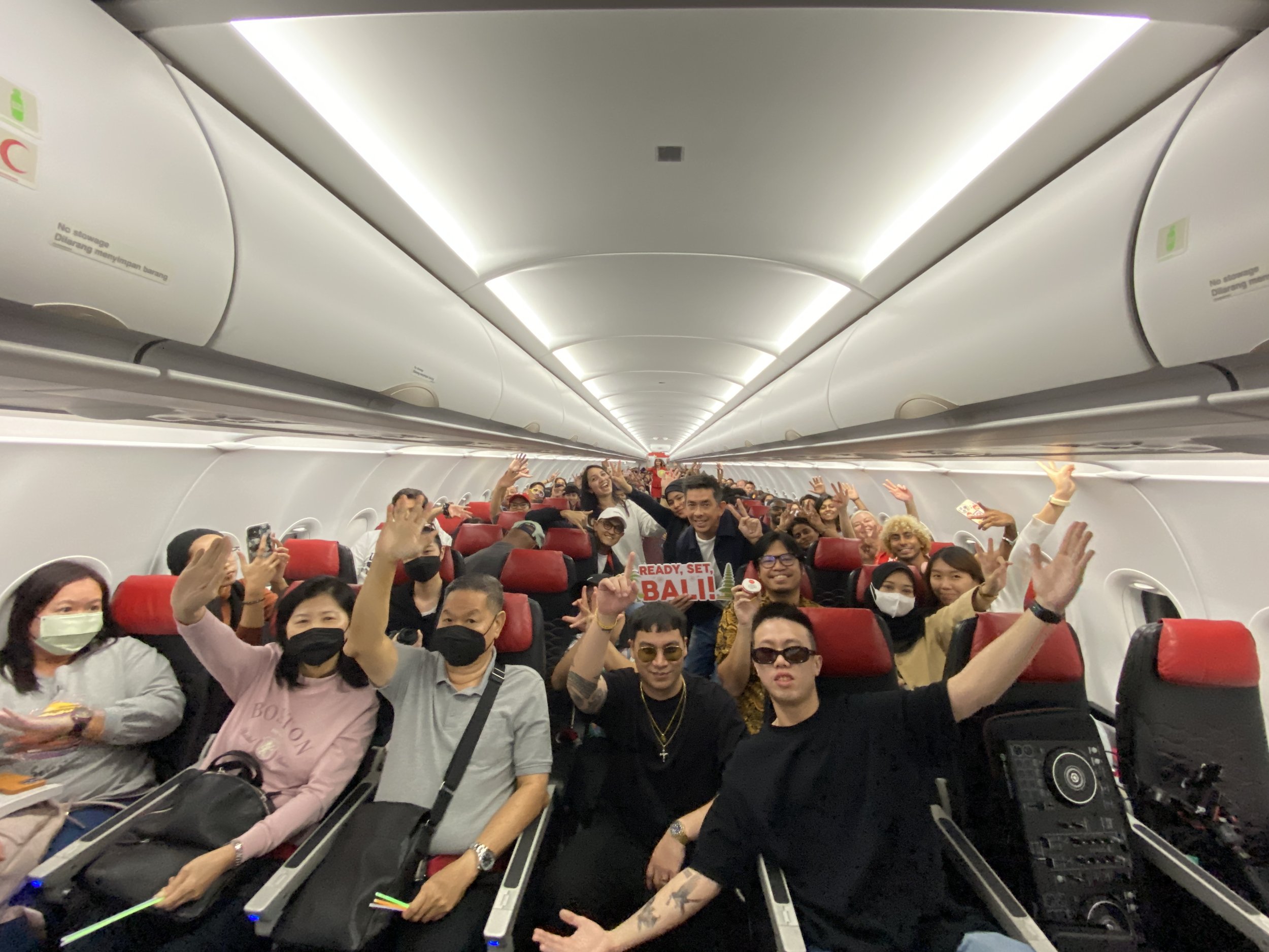   A historical flight: Thrilled guests, AirAsia Allstars and our men of the hour - BATE &amp; Airliftz - were onboard flight AK378 from Kuala Lumpur to Bali for AirAsia’s first ‘Party In The Air’.  