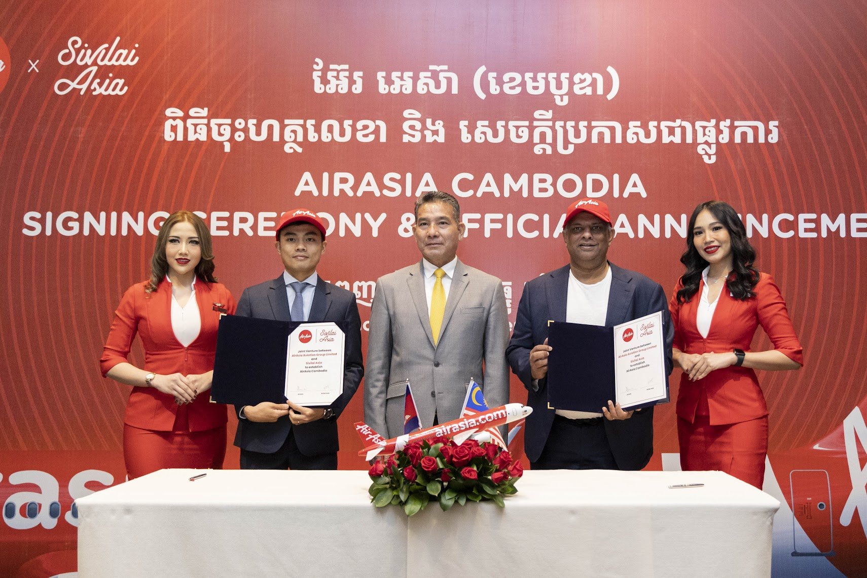   Photo Caption:  (Second from left)   Vissoth Nam, Director of Sivilai Asia and Tony Fernandes, CEO of Capital A at the AirAsia Cambodia Joint Venture signing ceremony, witnessed and presided over by His Excellency Dr. Mao Havannal, Minister in Char