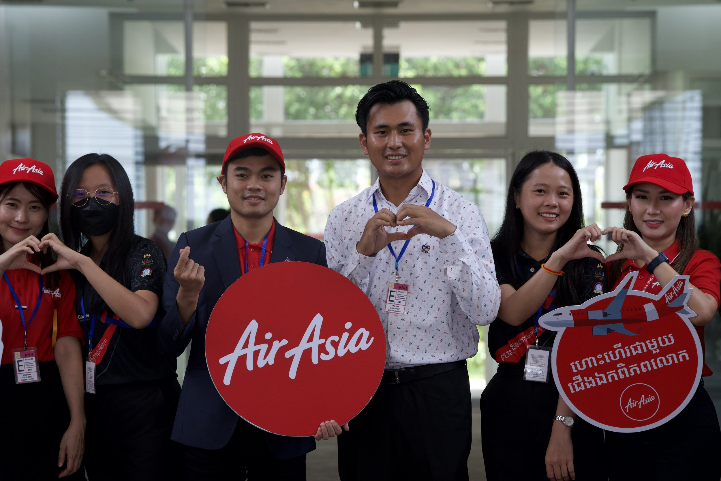 Photo Caption: (Third from left) Vissoth Nam, AirAsia Cambodia CEO and Soliya Kong, #BeyondTheGames Campaign Advisor at the Phnom Penh International Airport.
